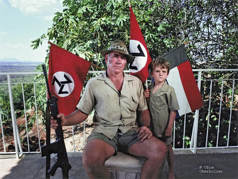 A father and son, members of the Neo-Nazi AWB movement, pose for the camera near Tzaneen in the Limpopo Province. © Obie Oberholzer