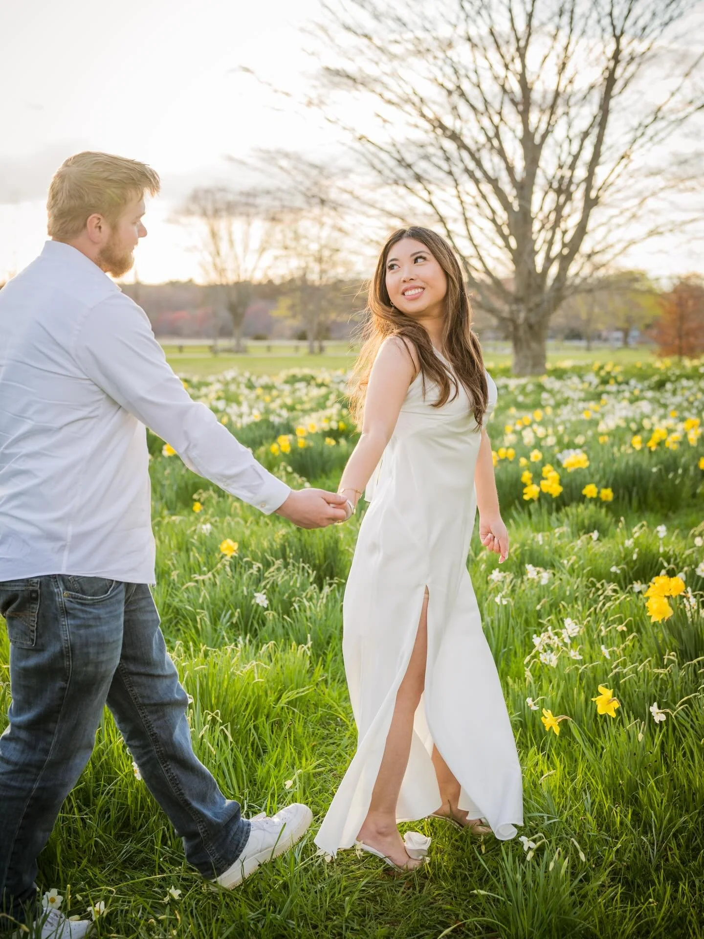 Before our epic sunset, Liv &amp; Marc &amp; Moose had the best time frolicking through the tulip field and had the most beautiful lighting for their engagement photos. Moose stole the show because look how cute he is. He had his little paw up on the