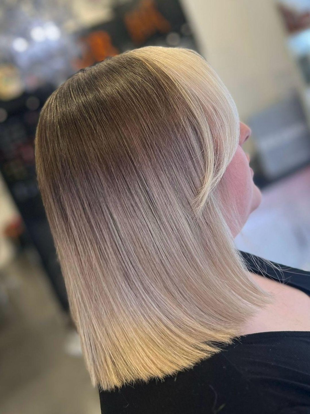 Striking the perfect balance with a sun-kissed touch! ☀️

Our client's shoulder-length hair boasts a delightful light brown blonde balayage, accentuated by a chic money piece fringe. Ready to elevate your style game? Click the link in our bio and let