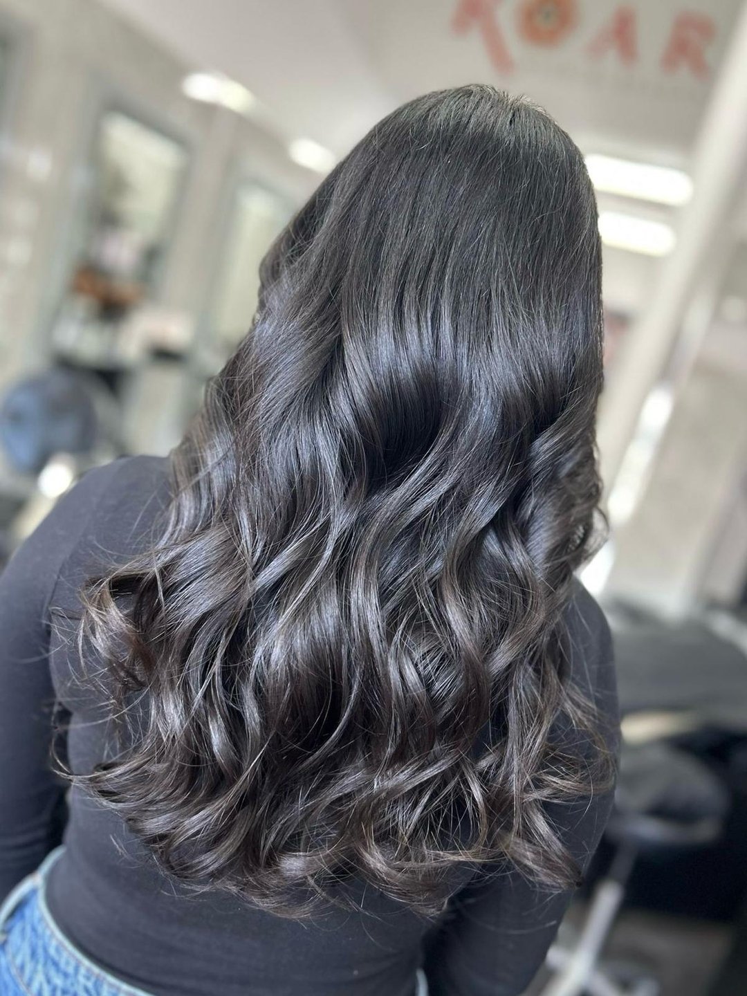 Unleashing the lustrous beauty of long, wavy black locks! ✨ 

Our client's hair is a glossy masterpiece that speaks volumes. Ready to turn heads with irresistibly shiny waves? Click the link in our bio and let's make your hair the epitome of brillian