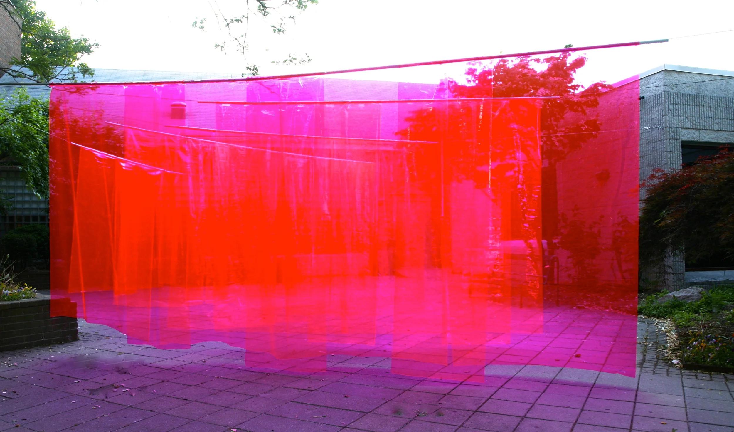 Wonderwall (Fluorescent Fuchsia Labyrinth) , 2014, transparent fluorescent vinyl, steel tubing and steel rope, audio speakers with digital sound composition. 9’ x 24' x 48’. Commissioned by the Pelham Art Center, Pelham, NY This ever changing experiential and interactive sonic installation responds to the architecture, space, exterior light, and visitors. Participants experience a minimalist transparent construction of light and sound. The sonic element was a remix, the source music for the remix is Wonderwall Music -- the soundtrack to the 1968 by English musician George Harrison's film Wonderwall.