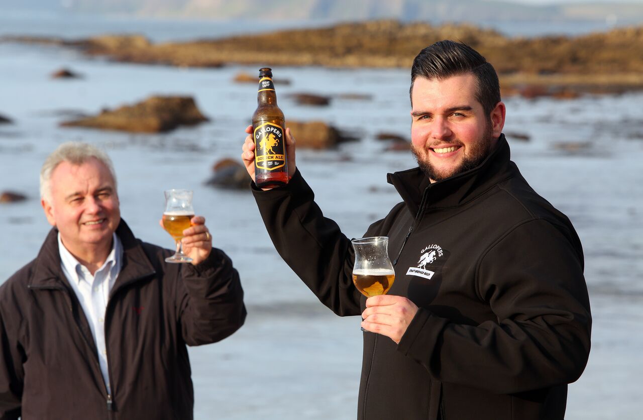 Declan and Eamon cheers on beach.jpg