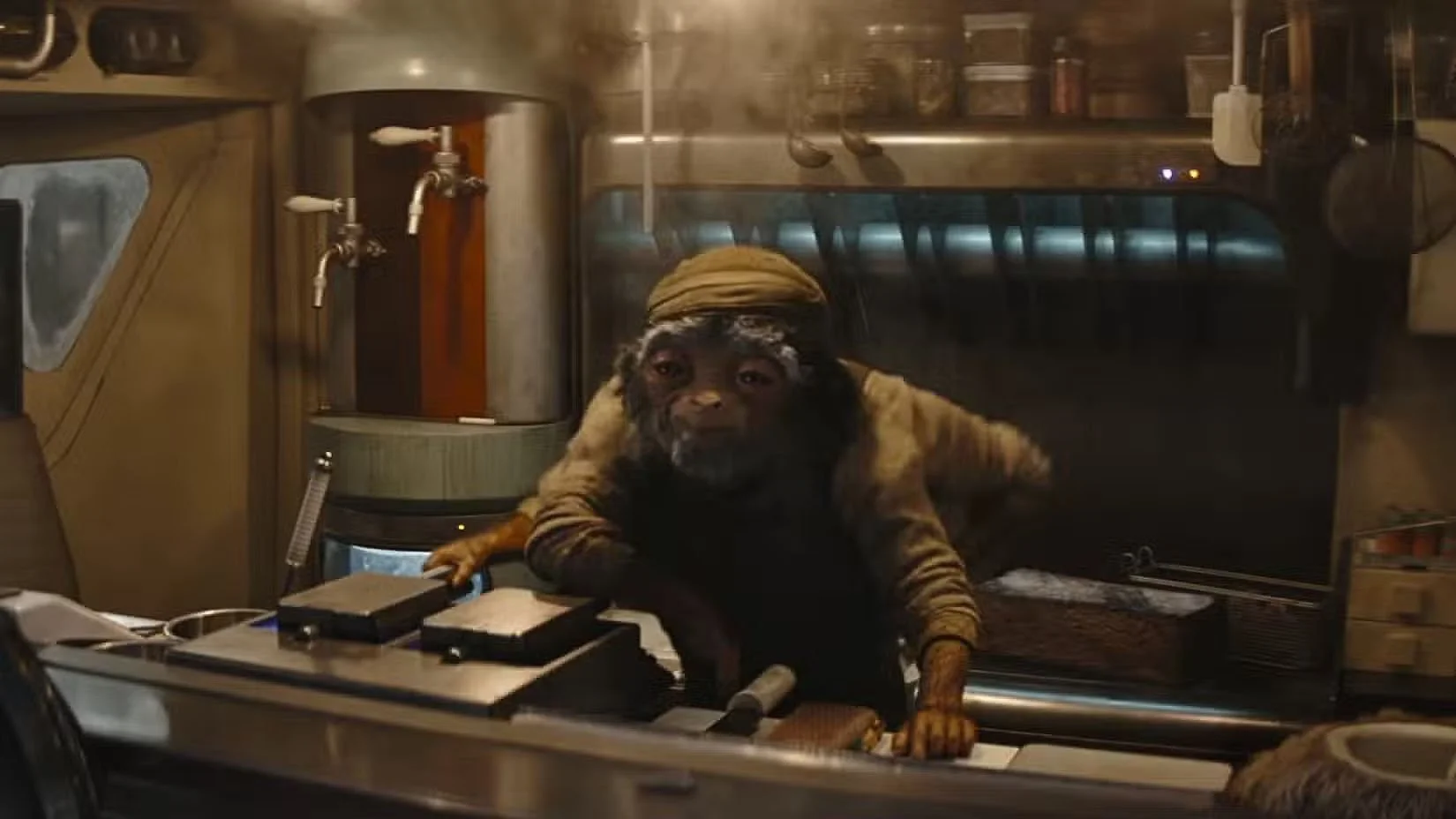 A still image from 'The Mandalorian and Grogu', showing a four-armed alien in a food truck.