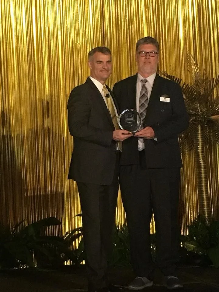 Jim DeVries, CEO of ADT and Andy Barclay
