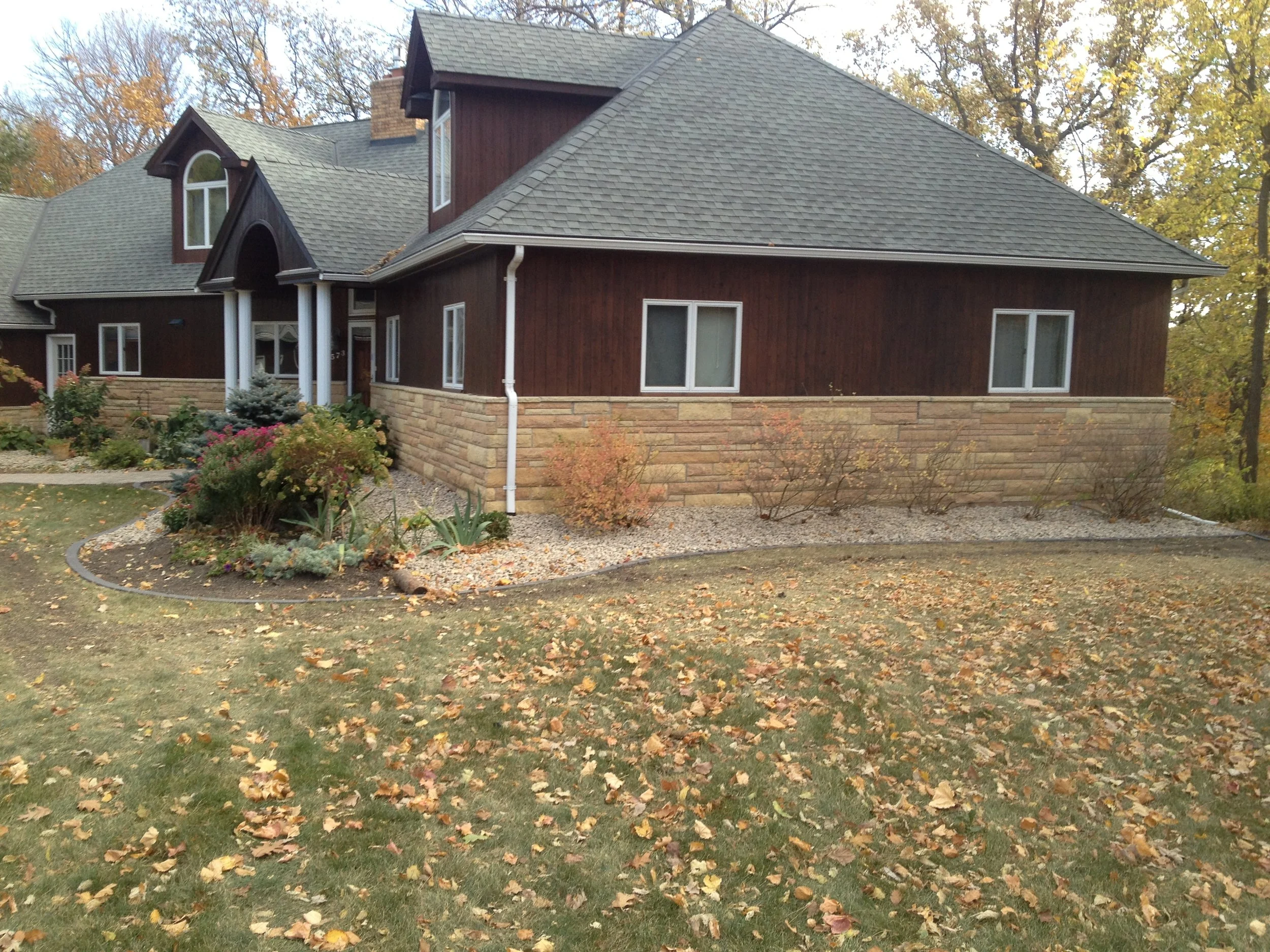 Landscaping with Edging, Shrubs and River Rock