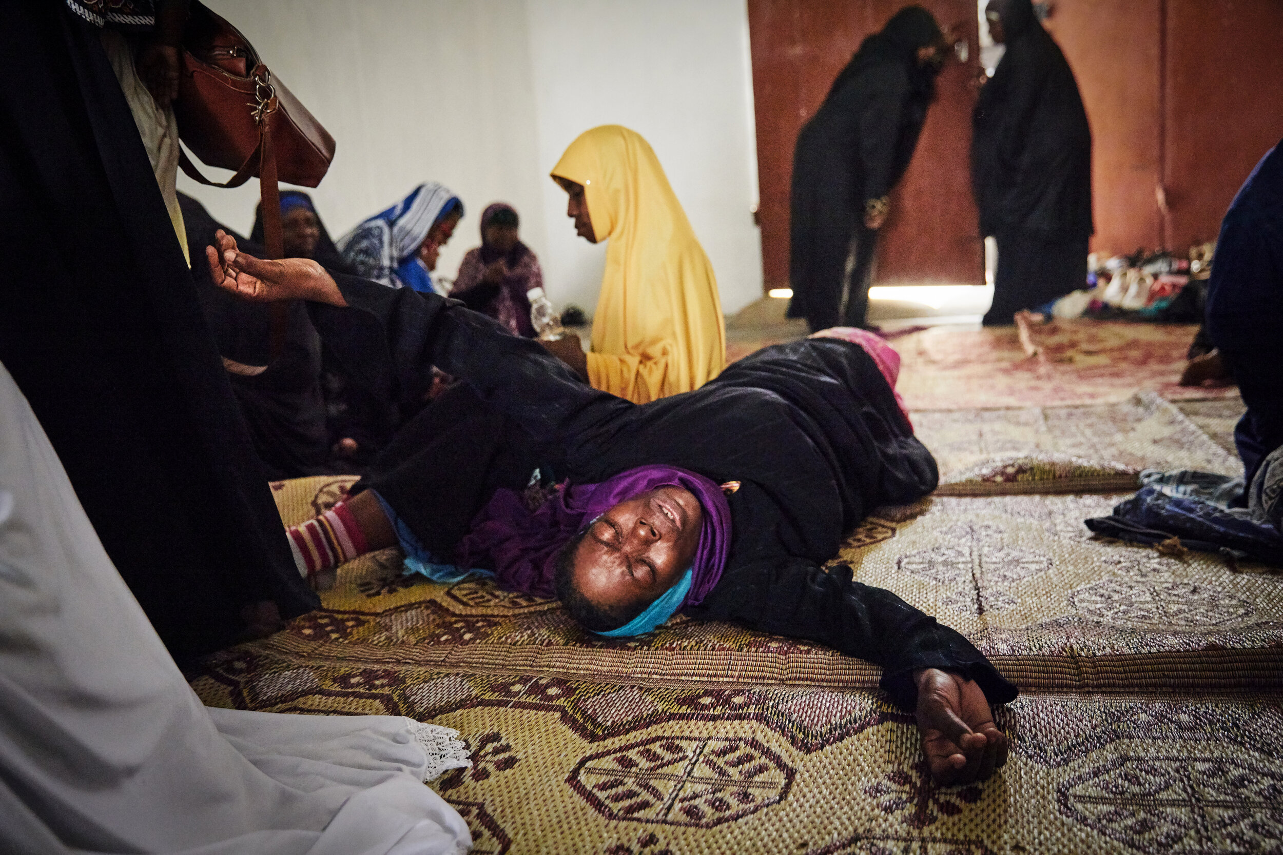   A woman writhes on the floor as she fights to release an apparent djinn possession (supernatural being that forces people to do its will) that is believed to be causing her stomach pains at the Shifaa Herbal clinic.  The act of dispossession is sai