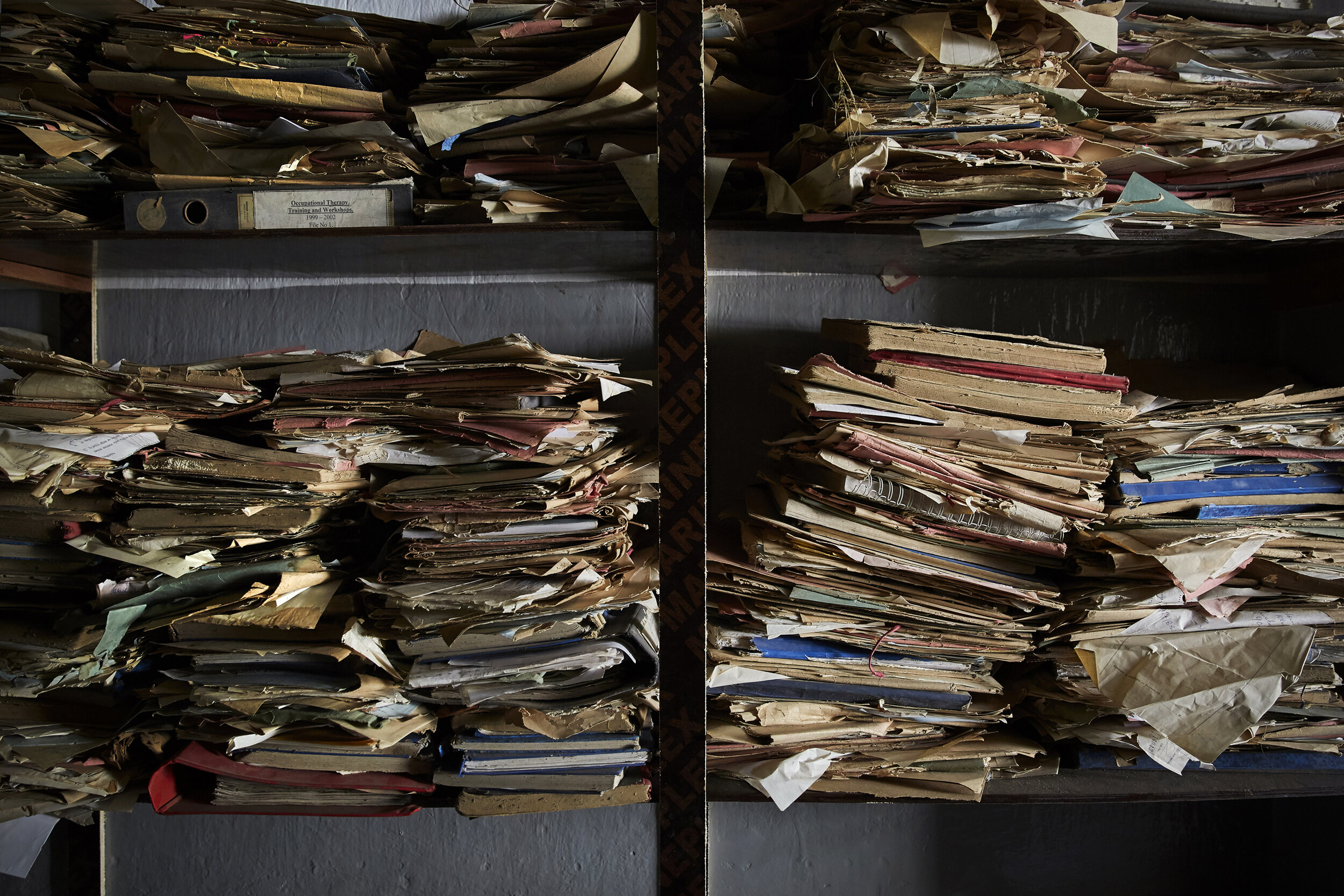  Hand-written patient files at Kidongo Chekundu Hospital, Zanzibar’s only psychiatric ward, which has no computers or filing system. All notes are written in longhand and stored on these shelves. These files date back roughly five years before they w