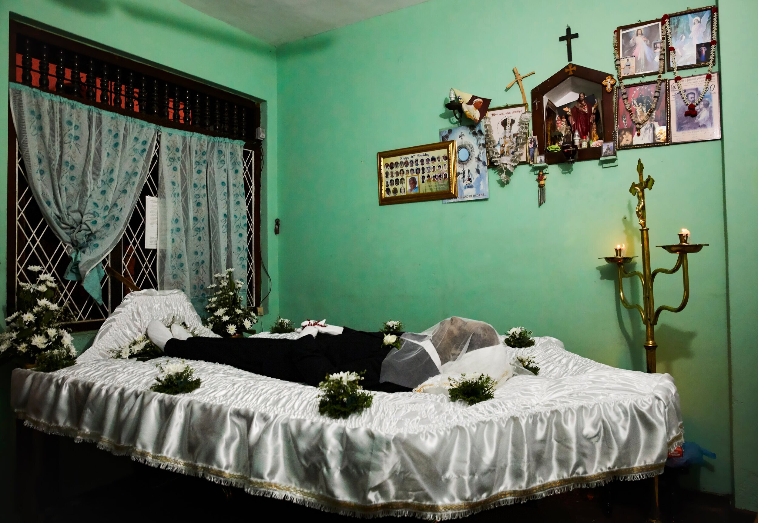  The body of a man killed in the Easter Sunday bombings rests in his family home waiting for burial  Colombo, Sri Lanka 