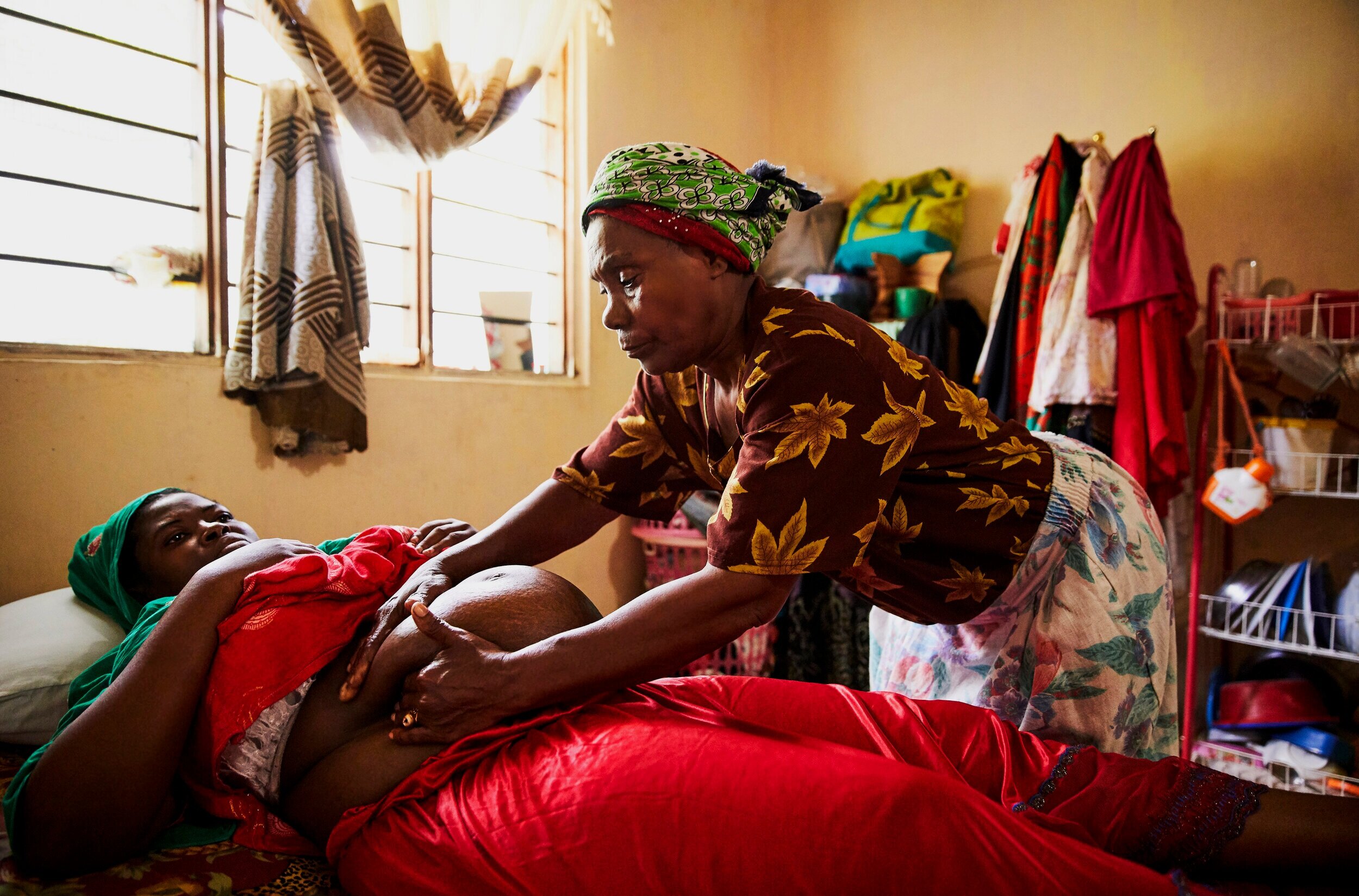  Traditional healer, Mwanahija Mzee, massages pregnant patient, Maryam Juma, 29. This is Maryam’s 5th pregnancy though 3 miscarried and 1 was stillborn, so she has no living children. Both she and the healer believe the reason she hasn’t been able to