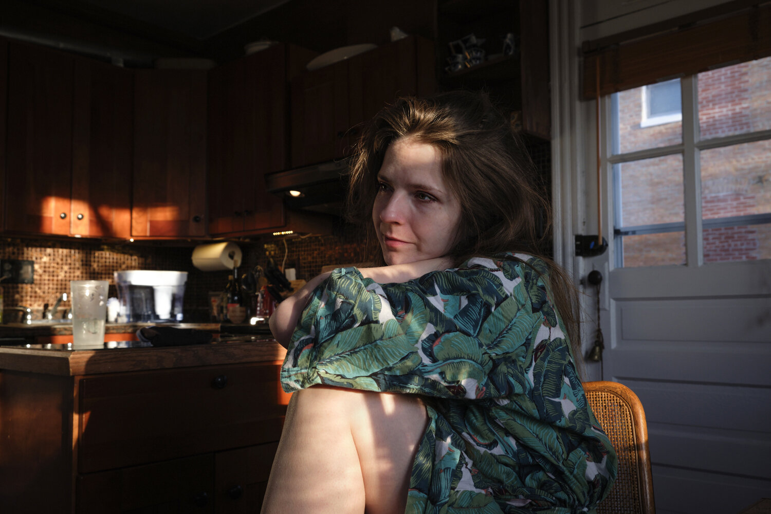  Kathleen Johns, 32, sits at her dining room table in the morning light in Washington,DC. Kathleen is a single mother of a 3 year old son Gabriel (not pictured), who works full time from home . Due to the Covid-19 pandemic, she has no childcare help 