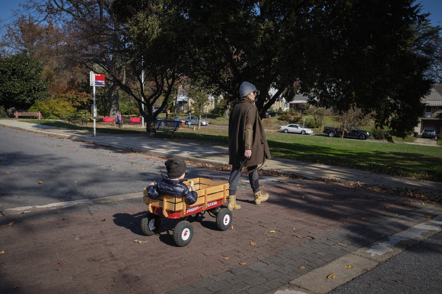  Kathleen pulls her 40 lb child in a Radio Flyer cart on their way to a local park. A single mother who works full time from home, with no childcare help, as even daycares have closed. She feels intensely bad for her son who does not have any friends