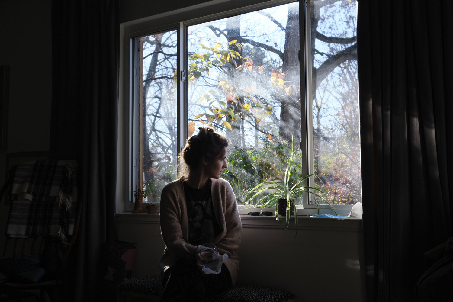  Kathleen looks out the window of her home.  