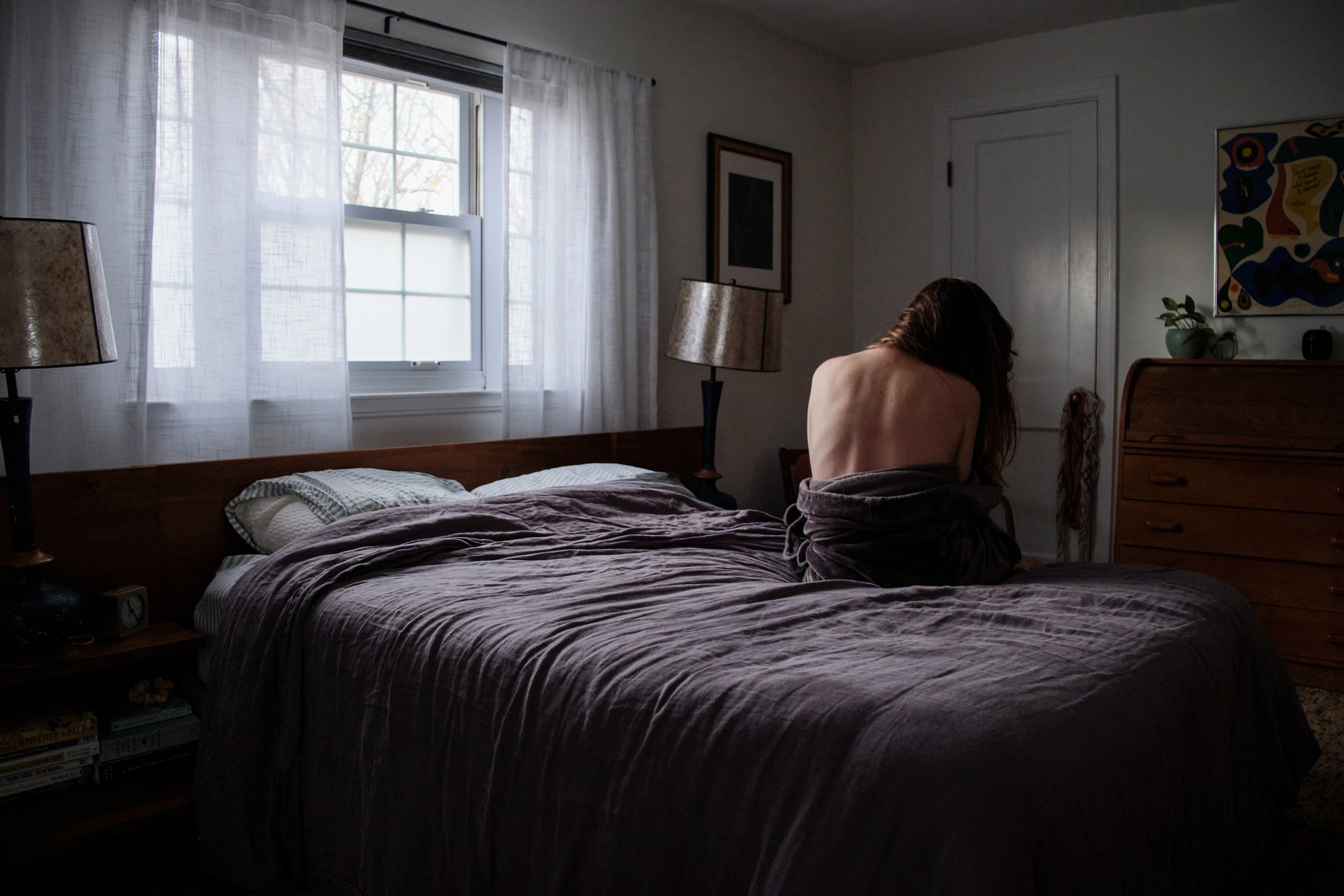  Kathleen Johns, 32, sits on her bed after an early morning shower in Washington,DC. Kathleen is a single mother who works full time from home, and owing to the Covid-19 pandemic has no childcare help for a 3 year old, which leaves her exhausted each