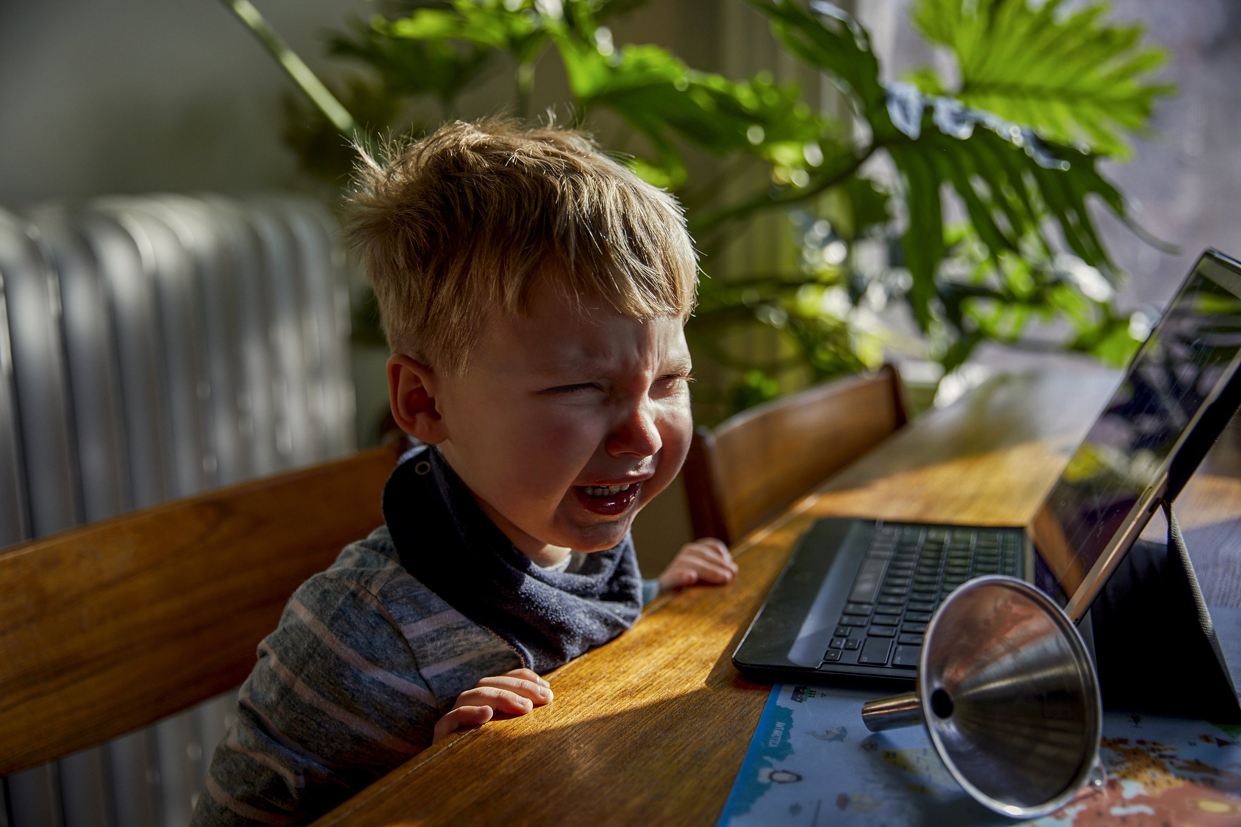  Gabriel, 3, cries at the dining table. He has asked for cheese crackers as part of his lunch, which the family ran out of yesterday . His mother, Kathleen,  is a single parent who works full time from home.  Due to the Covid-19 pandemic, she has no 