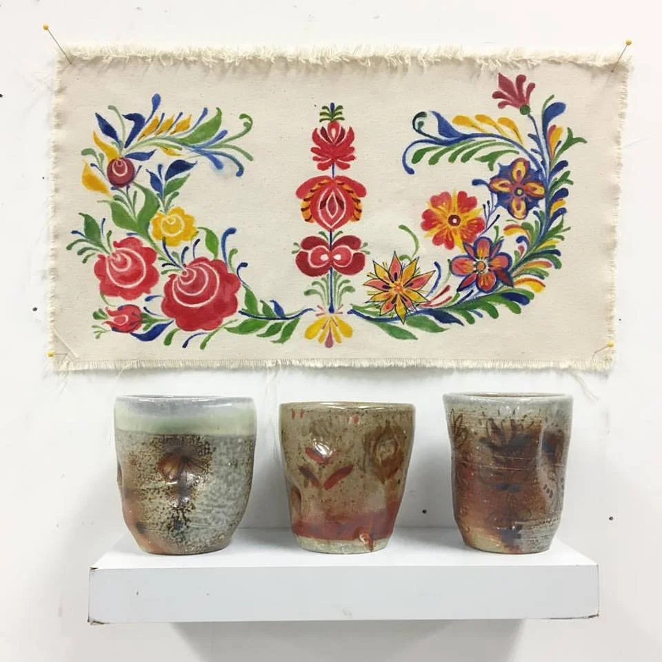 Me and My Folks, oil on unstretched canvas, displayed with thrown ceramic cups. Yellow Salt and Malcom Davis Shino over glaze pencil, soda fired, ∆10 (3pcs)