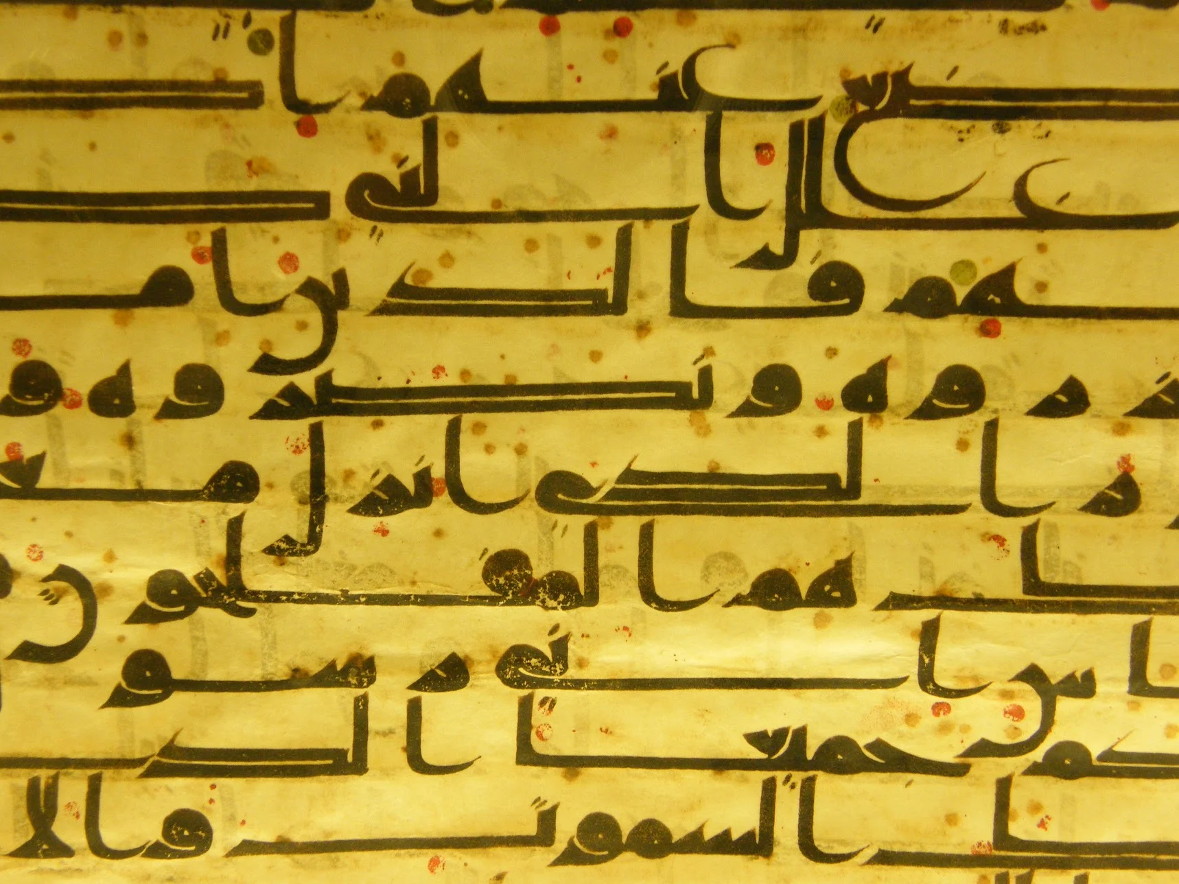 A panel of hand-lettered sacred text. Ancient Qur'an manuscript; Islamic Museum, Kuala Lumpur.