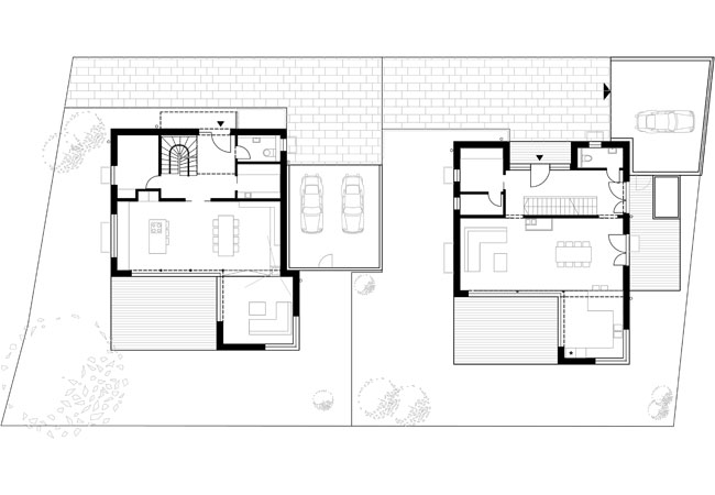 Auf einem Grundstück in einer gewachsenen Siedlung in Ebersberg wurde ein altes Bestandsgebäude abgerissen und es werden zwei neue Einfamilienhäuser gebaut. Die Bauherren, zwei Familien mit jeweils zwei Kindern, lernten sich erst im Zuge der Planung kennen. Es entstanden trotzdem zwei ähnliche, aber nicht gleiche Baukörper, die im Zusammenspiel eine Einheit bilden. Kubische Formen, Flachdächer, weiße Fassadenflächen mit dunklen Fenstern und Fassadenelemente mit Holzschalung wecken Assoziationen zu Wohnhäusern aus den 1920er Jahren. Durch die L-fömigen Baukörper werden im Erdgeschoss kleine Atriumhöfe gebildet, die durch die Orientierung zur Abendsonne private Freibereiche mit hoher Aufenthaltsqualität schaffen. Die Dachterrassen im 2. Obergeschoss, den Elternschlafbereichen zugeordnet, bieten Fernblicke auf die Bergkette des Chiemgaus bis den Hohen Tauern. Offene Erschließungsbereiche, großzügige Kinderzimmer und flexibel abtrennbare Arbeitsbereiche schaffen einerseits fließende Raumübergänge, aber andererseits auch private Rückzugsbereiche. Die Gebäude sind mit Wohnraumlüftung mit Wärmerückgewinnung ausgestattet, das Brauchwasser wird über Solaranlagen erwärmt. In monolithischer Bauweise errichtet und mit hochwertigen Materialien ausgestattet, schaffen die beiden Gebäude eine neues Zuhause für zwei junge Familien.