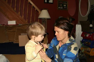 Our midwife plays with our son, to make sure he feels included and valued in the moments after our newborn's homebirth in Queens (BirthMattersNYC blog)