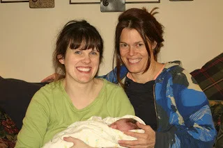 Mom, newborn, and our great midwife, moments after homebirth in Queens (BirthMattersNYC blog)