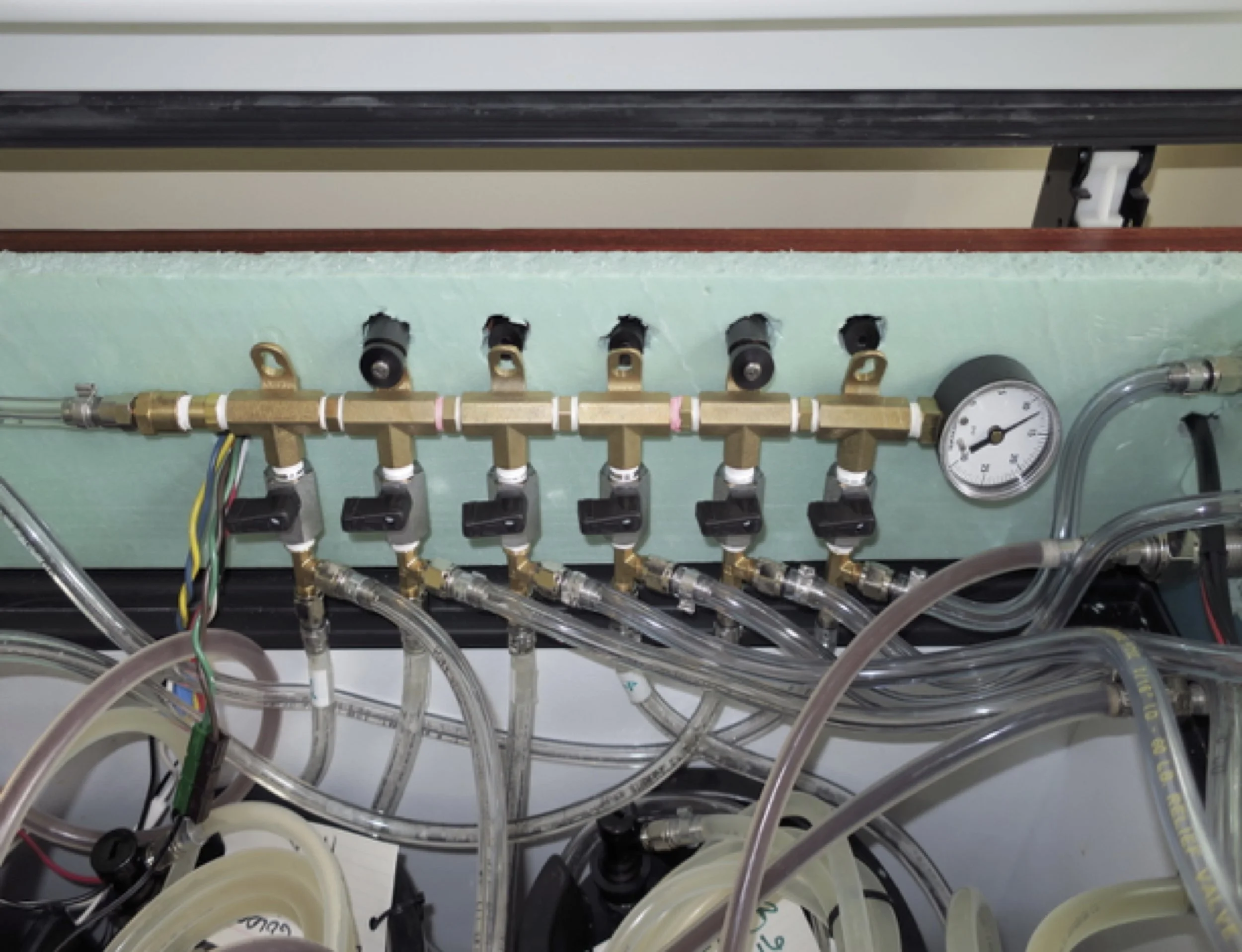 The cross connect manifold inside the keezer; note the valves are all closed.