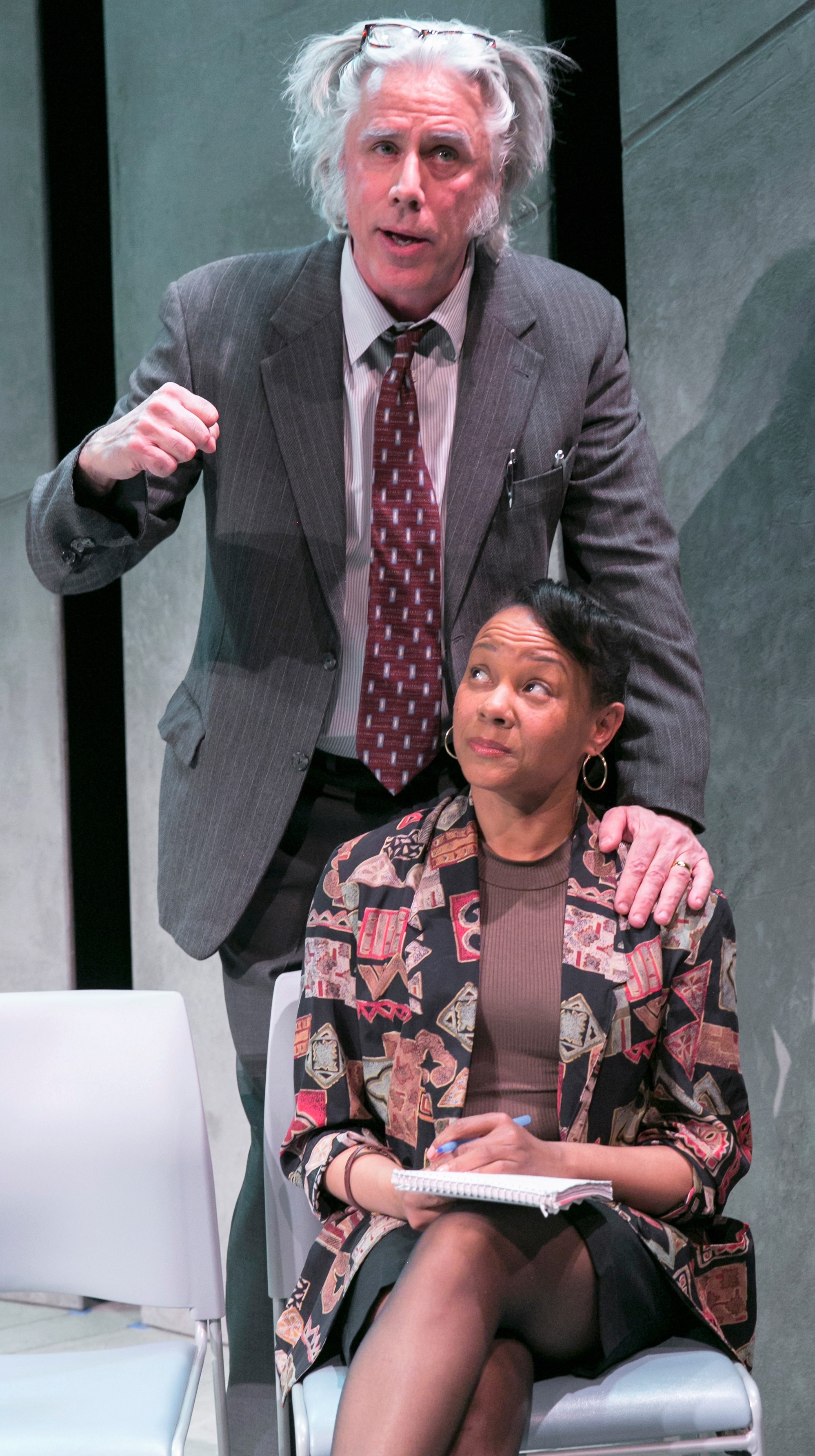 Above and top: Jeff McCarthy plays famed lawyer William Kunstler, and Nambi E. Kelley is his handler Kerry at a university speaking engagement in Jeffrey Sweet's Kunstler . Photos by Heidi Bohnenkamp.