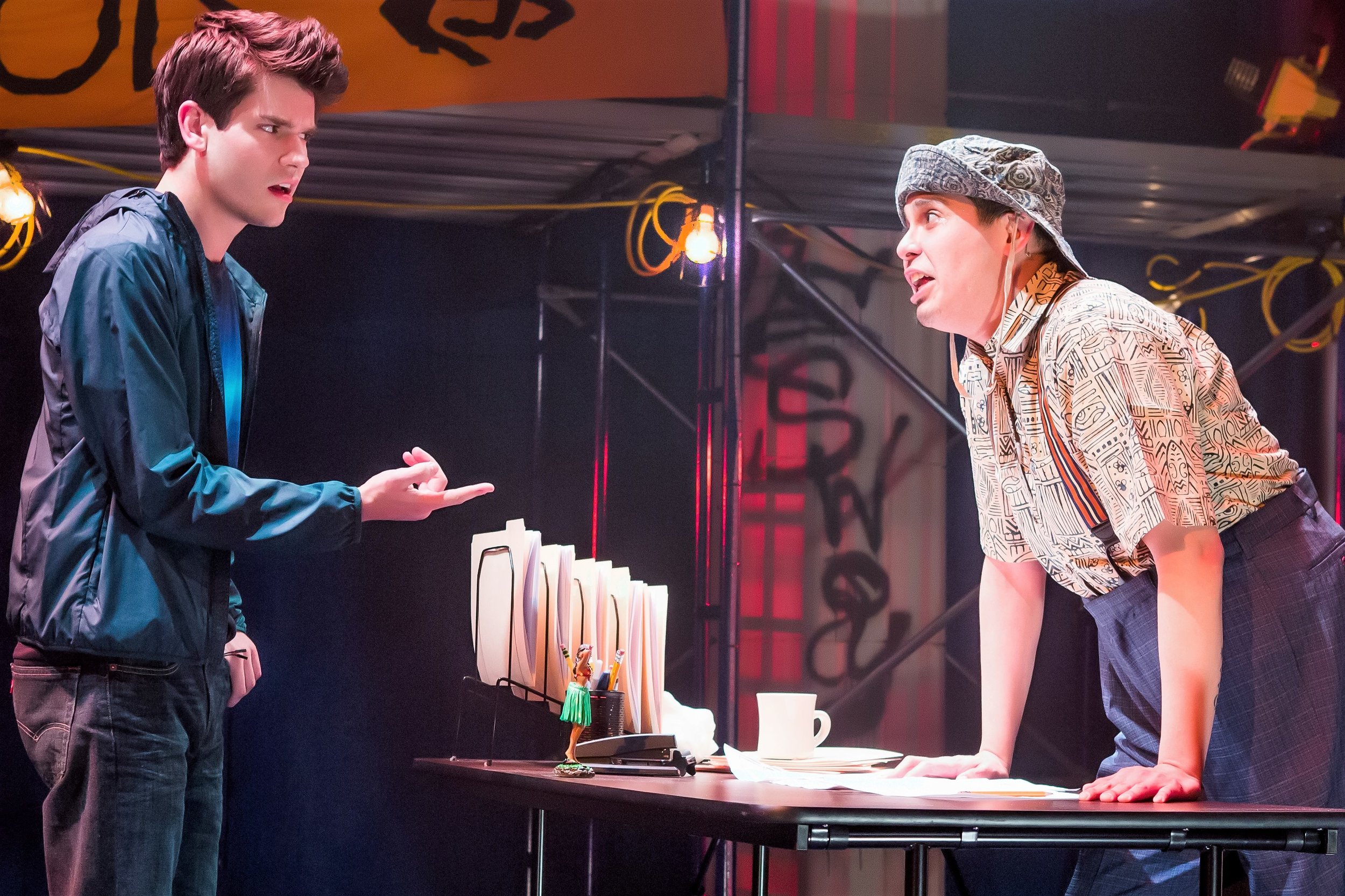 Percy (Chris McCarrell, left) gets a tongue-lashing from Mr. D (George Salazar) at Camp Half-Blood. Top: Percy meets the Oracle (Carrie Compere), but can she be trusted?
