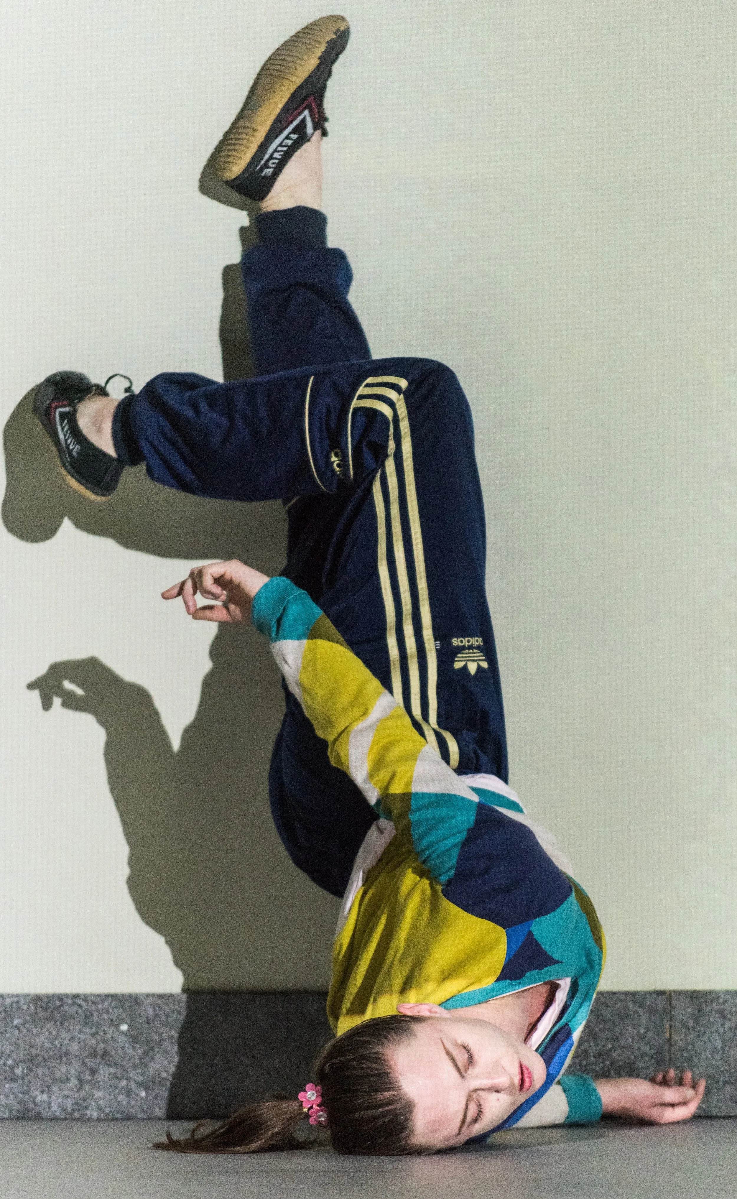 Oona Doherty dances in full Sporty Spice drag. Top: The Young Man (Hugh O'Conor) tries to keep up with Isla (Charlie Murphy).