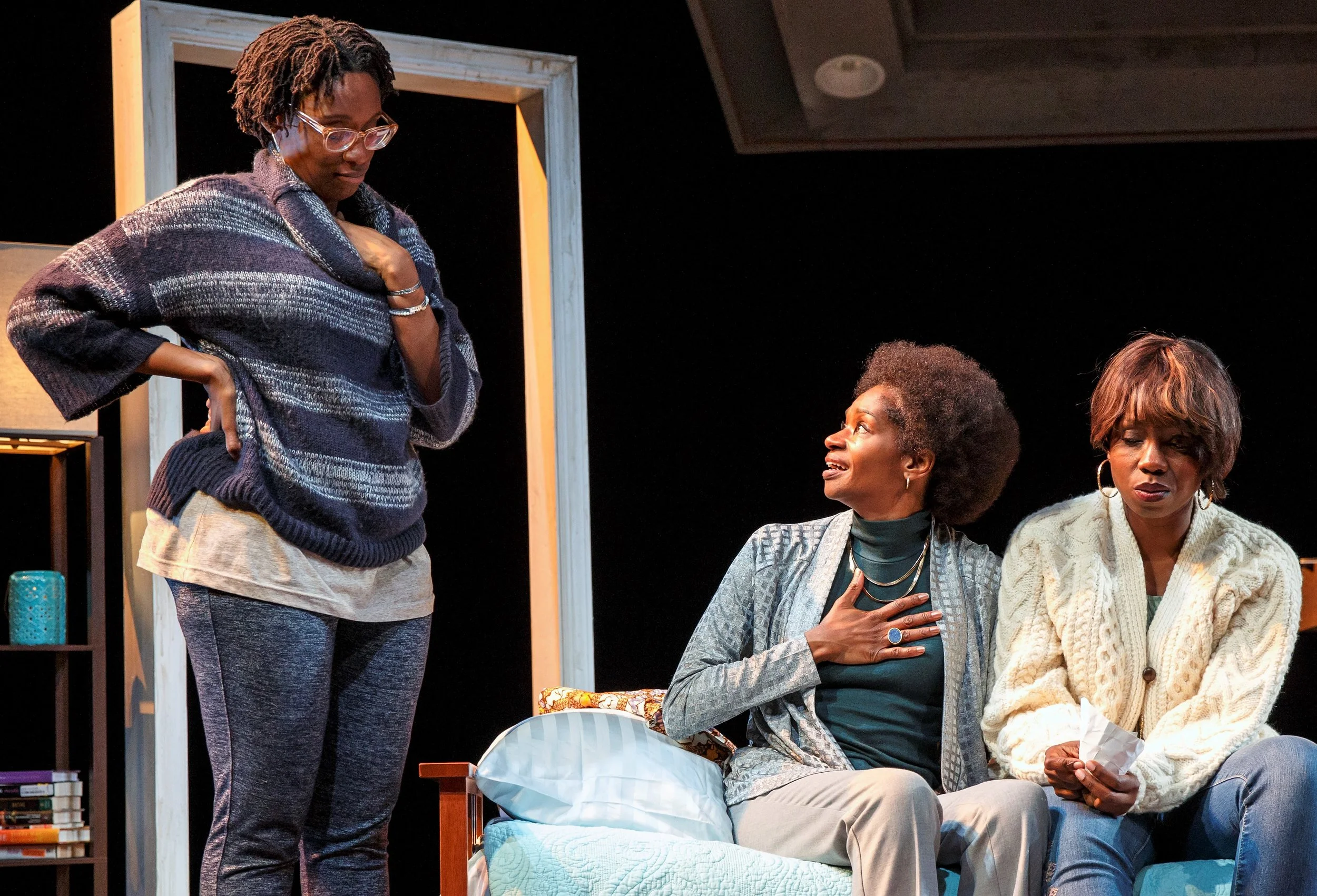 From left: Adiagha (Ogbuagu), Ama (Jenny Jules), and Iniabasi (Adepero Oduye) achieve a tenuous peace in Her Portmanteau . Photos by Joan Marcus.