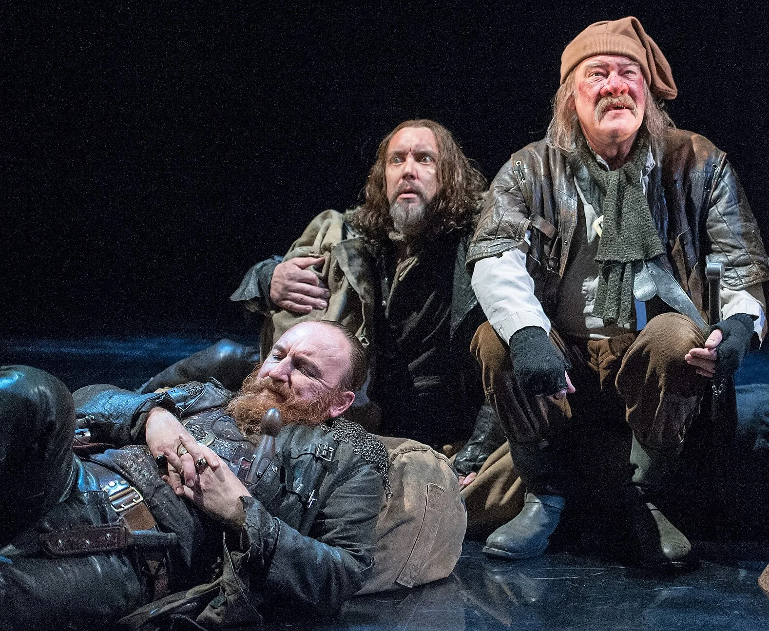 From left: Antony Byrne as Pistol, Christopher Middleton as Nym, and Joshua Richards as Bardolph are the remnants of Falstaff's followers in Henry V. Top: King Henry V (Alex Hassell, left) listens to the Archbishop of Canterbury (Jim Hooper) elucidate his claim to the French throne.