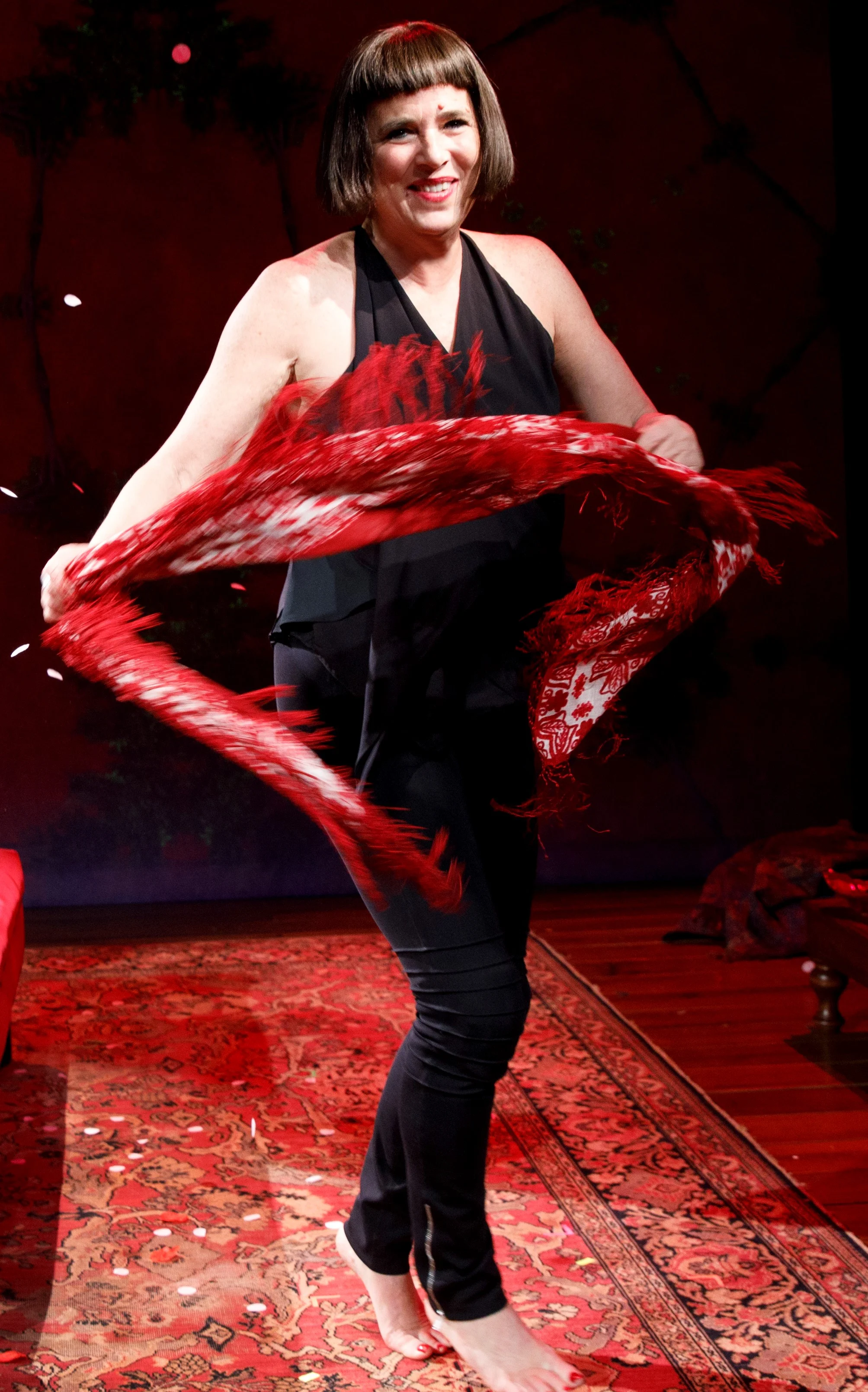 Eve Ensler enlists the audience in a “tree party” dance in her new solo show, In the Body of the World . Top: Ensler considers the ways cancer changed her inside and out.