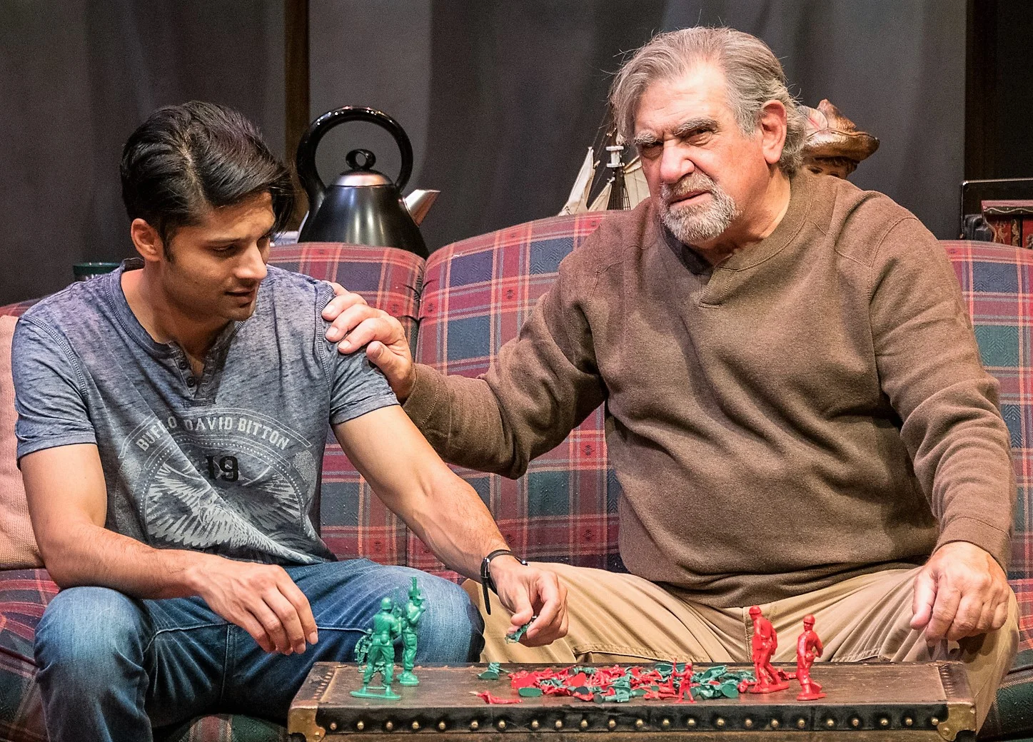 Rupak Ginn (left) plays Peter Chandler, a young artist in a battle of wits with artist Simon Grindberg (Dan Lauria) in Shem Bitterman’s The Stone Witch . Top: Lauria with Carolyn McCormick as Clair Forloni, his agent. Photographs by Russ Rowland.