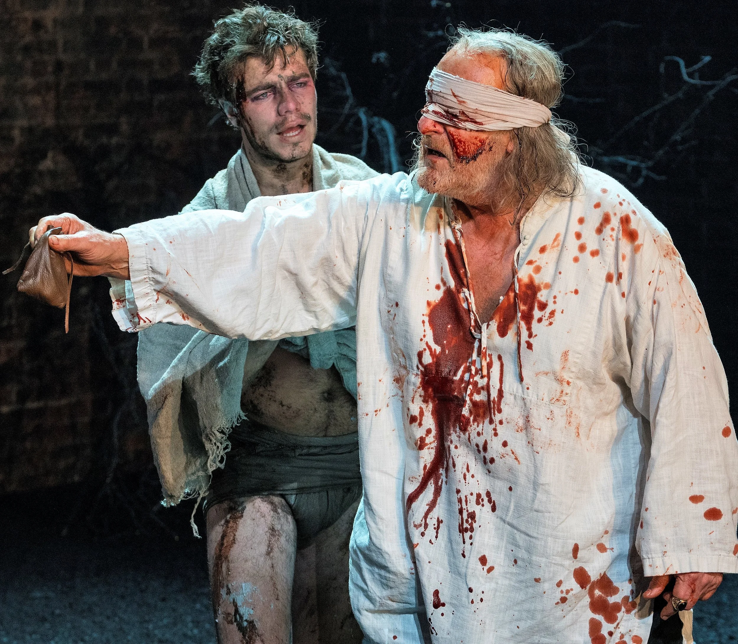 Oliver Johnstone (left) is Edgar, and David Troughton plays his blinded father, the Earl of Gloucester, in King Lear . Top: Antony Sher as Lear rails against his oldest daughter, Goneril (Nia Gwynne), as Kent (Antony Byrne, left) looks on.