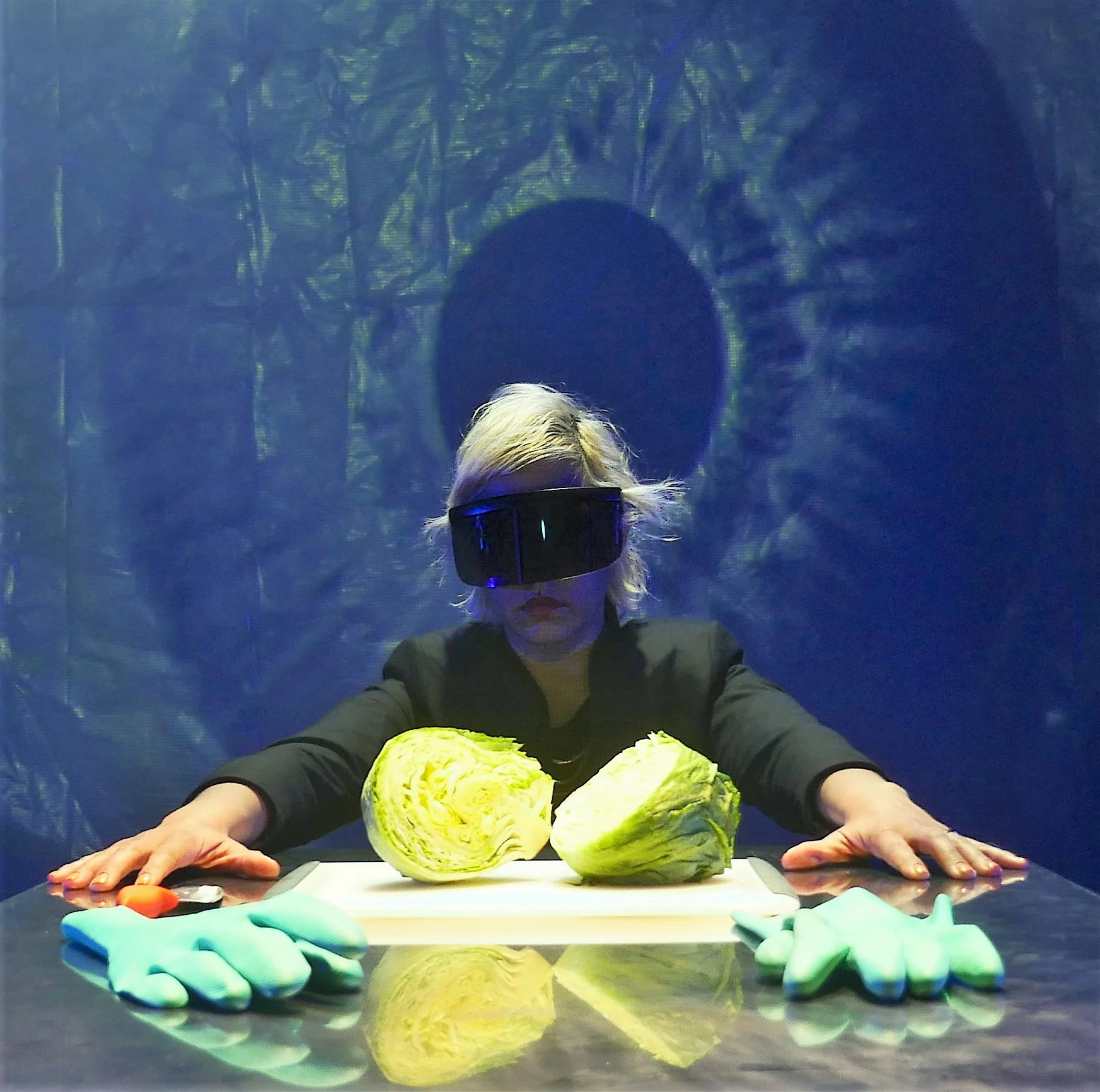 Jessica Almasy contemplates a head of lettuce as she talks about the brain. Photo by Charlie Dennis.
