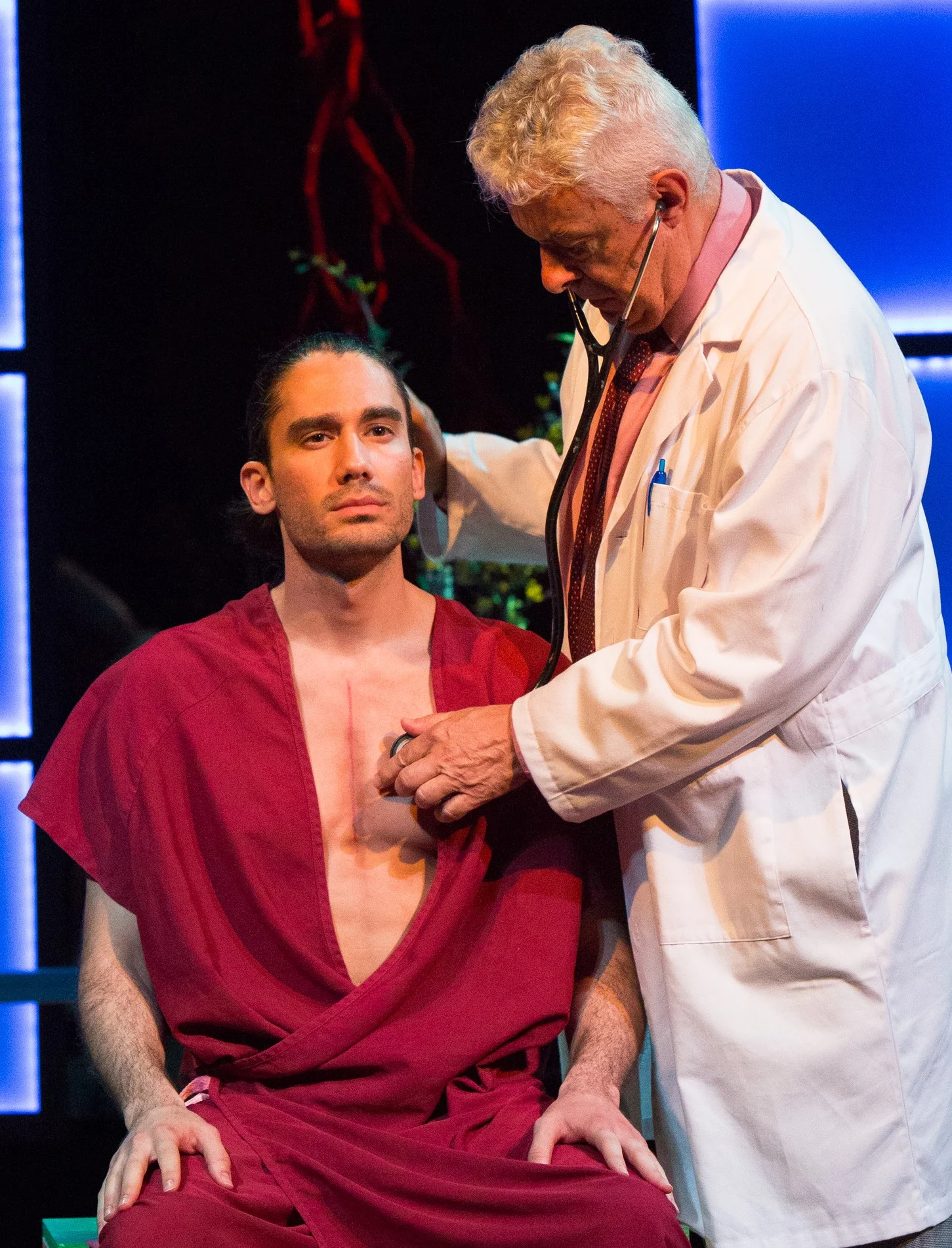 Gilberto Gabriel Diaz Flores as Amér (left) with Germán Jamarillo as Dr. Castillo in Nilo Cruz’s, Exquisita Agonía at Repertorio Español. Top: Luz Nicolás as Millie listening to Amér’s heart.