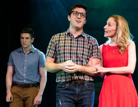 Neurosis (Brennan Caldwell, left) isn’t happy when the human he nests in, Frank (Kevin Zak), meets a young woman (Jennifer Blood) who starts to diminish his powers. Top, from left: Joel Blum as Frank’s father; Morgan Weed as Neurosalina; Blood; Zak; Caldwell; and Susan J. Jacks as Frank’s mother.