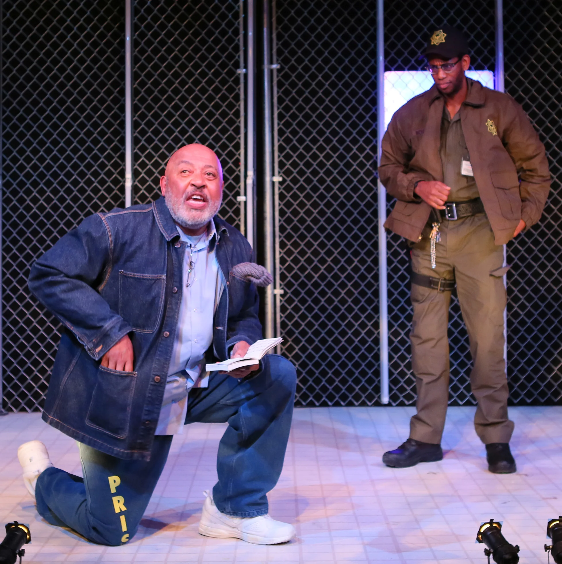 Keith Randolph Smith’s Wise (left) submits to the extreme security measures of Eric Berryman’s commanding officer, in Lockdown . Top: Smith and Berryman with Zenzi Williams as Ernie.