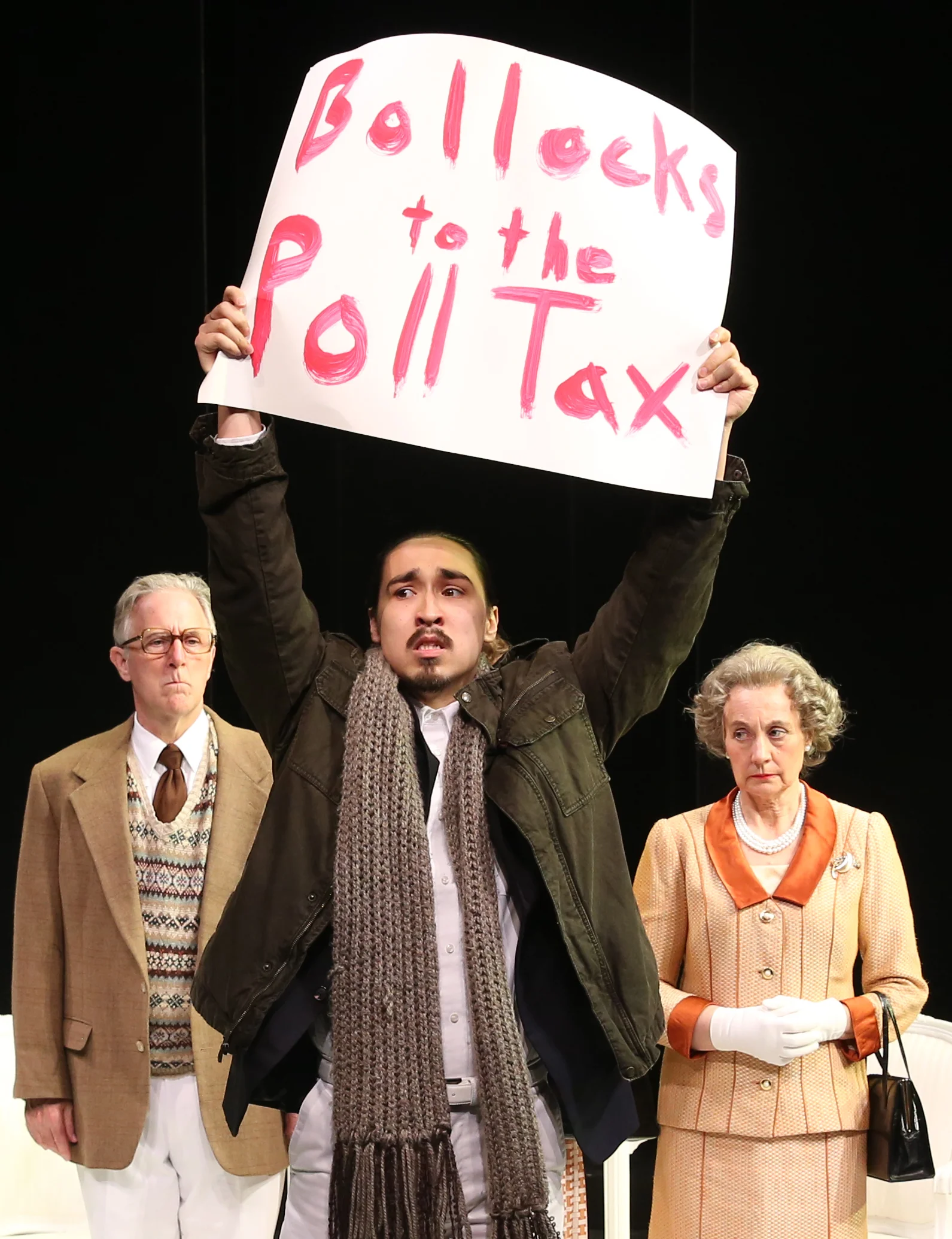 From left: Baron Geoffrey Howe (John Lescault), a protester (Cody Leroy Wilson) and Q weigh the poll tax.