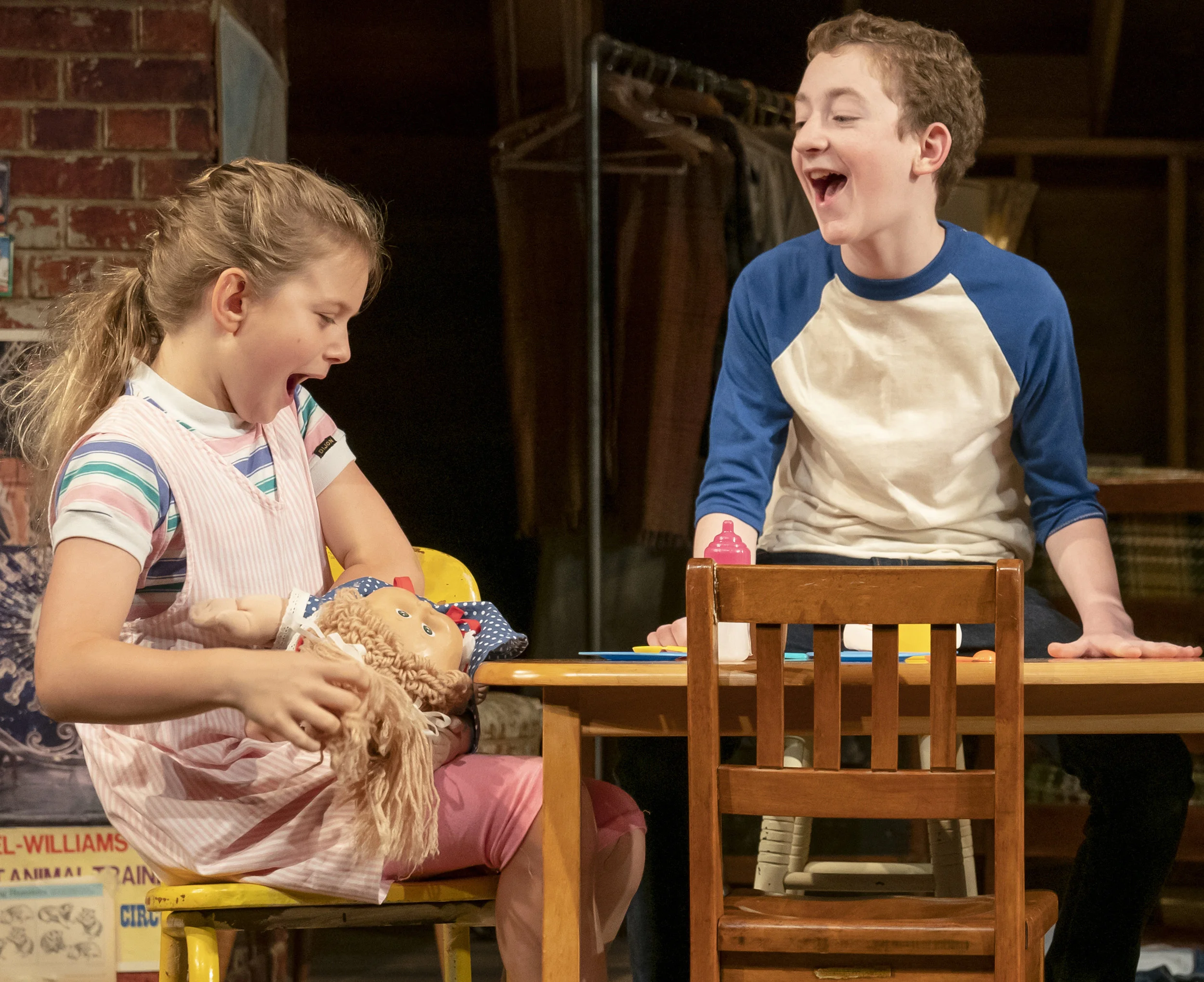 Casey Hilton as Young Addie (holding her beloved doll Babs Kimbra) and Ryan Foust as Young Chris play make believe at a moment when the real world is too frightening to contemplate.