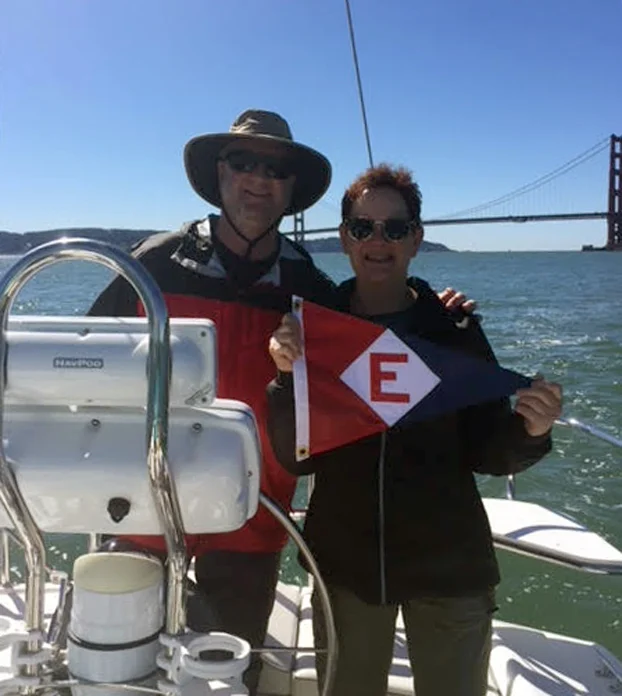 Bob and Suzanne Pritchard hoist their EYC colors in San Francisco Bay.