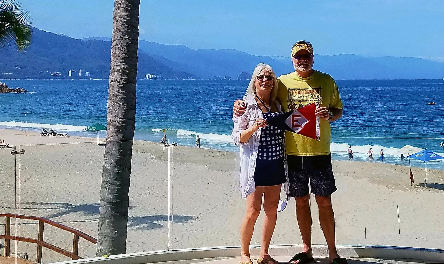 Murray and Linda McLeod show their EYC pride on a sunny beach in Puerto Vallarta, Mexico.