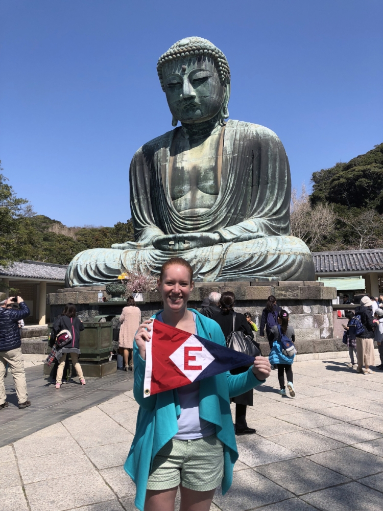  In Tokyo, Japan, Sara (daughter of Gary &amp; Jane) shows the EYC colors at the feet of the Buddha 