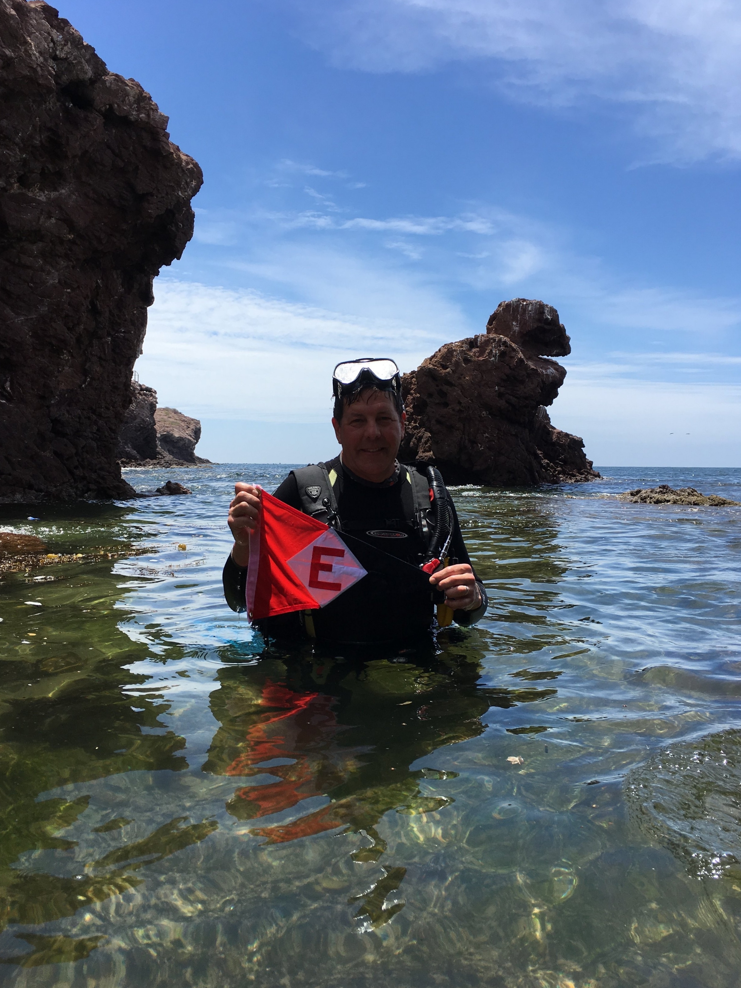  On a diving trip to the Sea of Cortez, Rob takes a moment to show his EYC pride. 