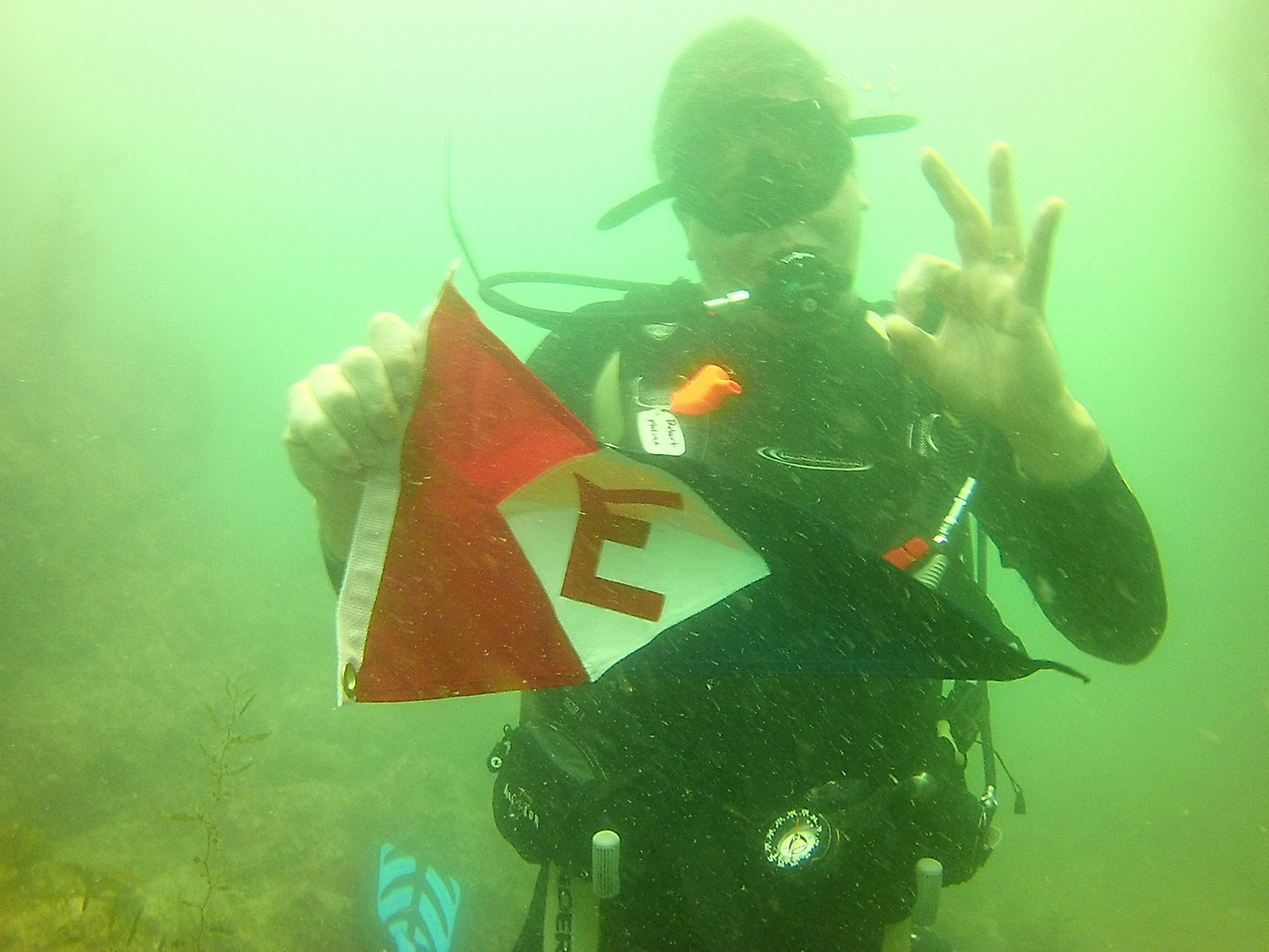  Rob  checking to see if the EYC burgee is waterproof in the Sea of Cortez, Mexico. 