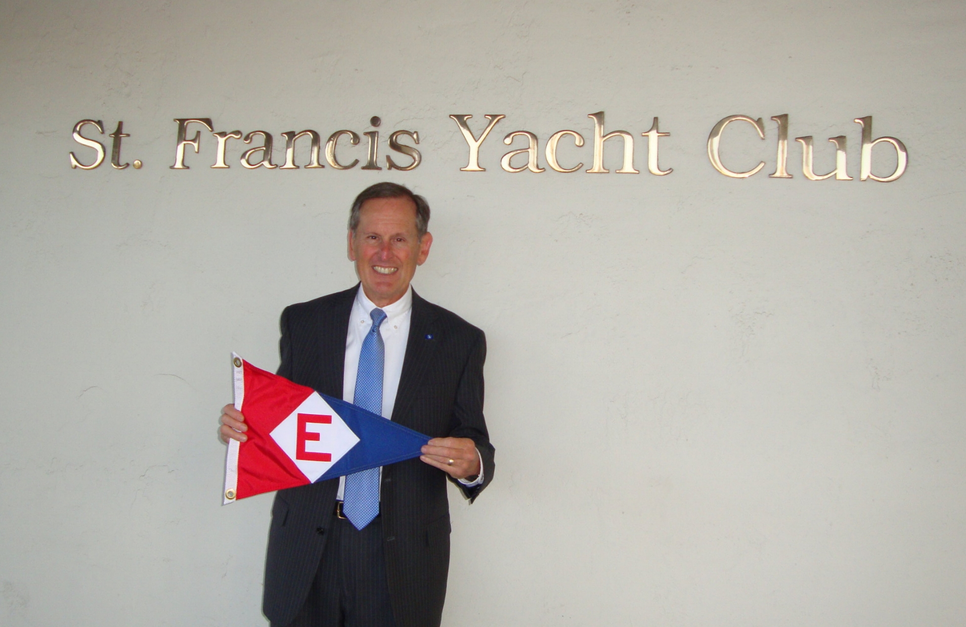  Commodore Gary shows the EYC colors prior to a burgee exchange with St Francis Yacht Club in San Francisco, CA. 