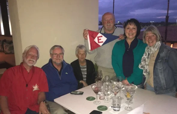 Ken, Richard, Bonnie, Rex, Marie, and Chris gather at Tommy Bahamas in Palm Desert, CA to raise the colors