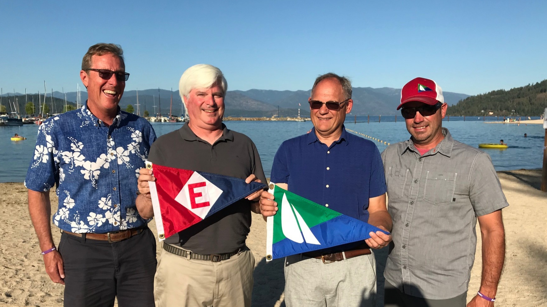  Club Manager Rich Aaring exchanges burgee with Past, Current and Vice Commodores of Sandpoint Sailing Association in Sandpoint, ID 