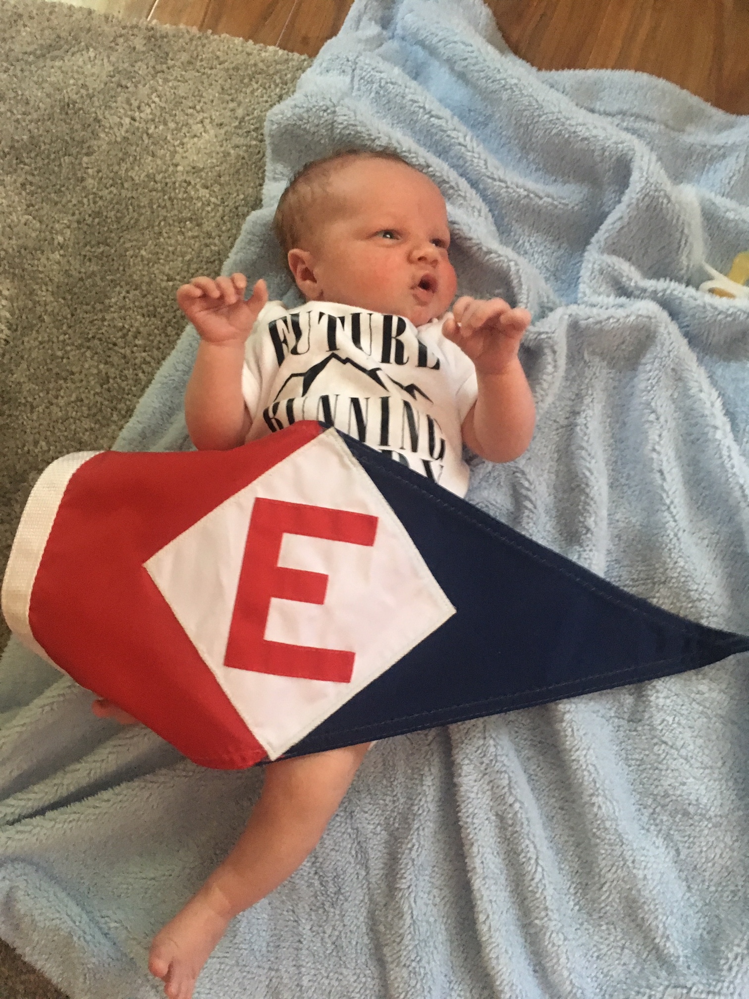 Owen Robert, the newest member of the EYC family, shows his EYC pride 