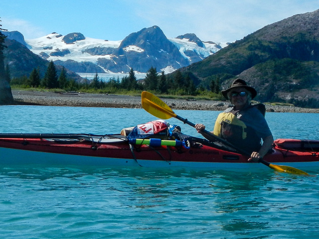  Kay Lee proudly flies her EYC burgee on a sea kayaking trip in Prince William Sound, Alaska 