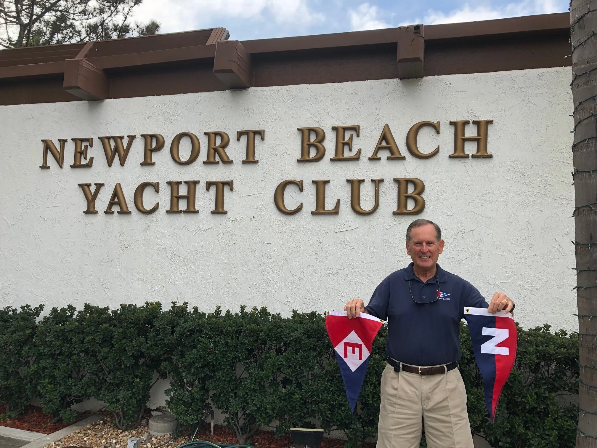 Gary exchanges burgees with the Newport Beach Yacht Club in California