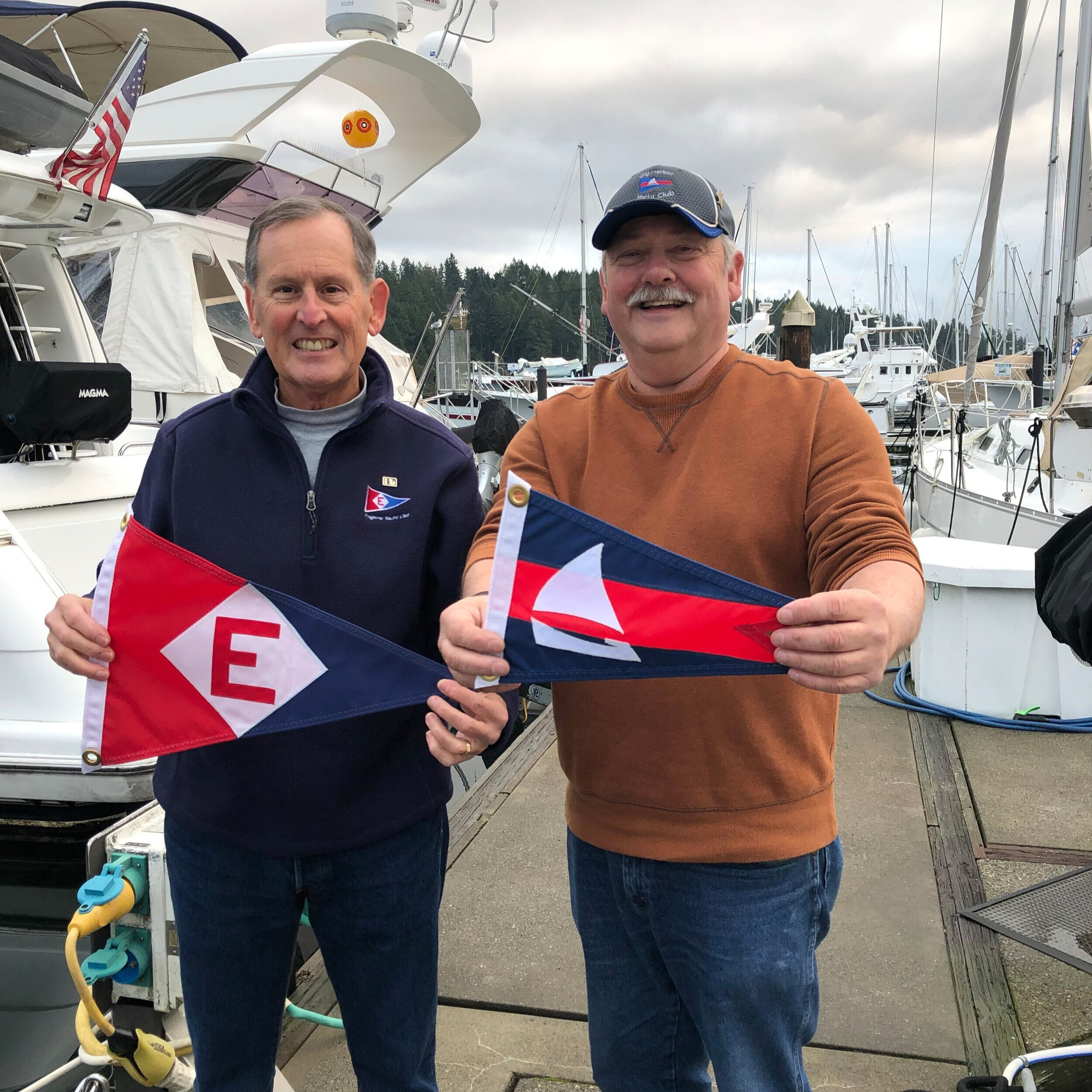  Gary exchanges burgees with the Commodore of Gig Harbor Yacht Club in Washington 